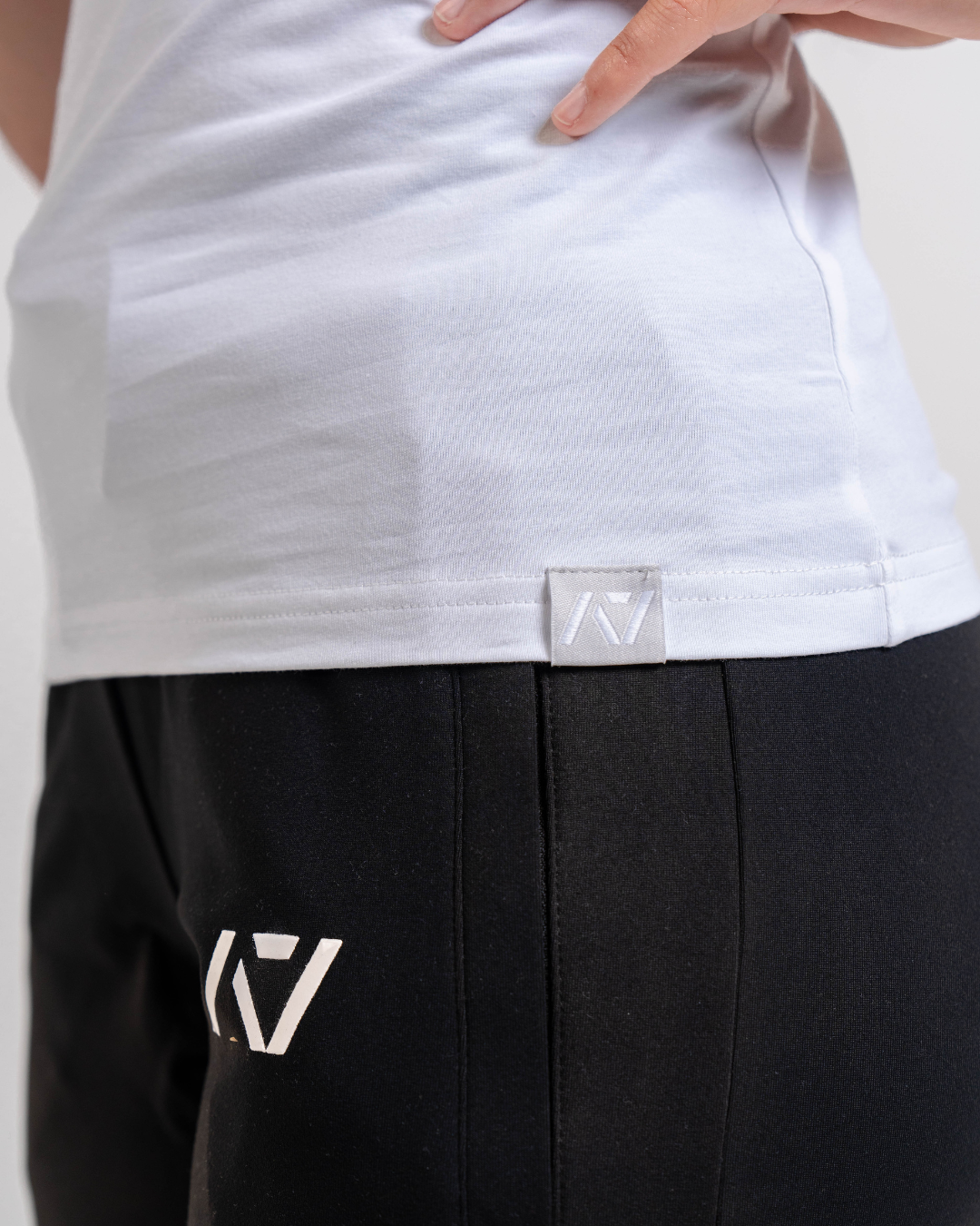 Bottom Hem Tag with A7 Logo on the bottom front of the meet shirt