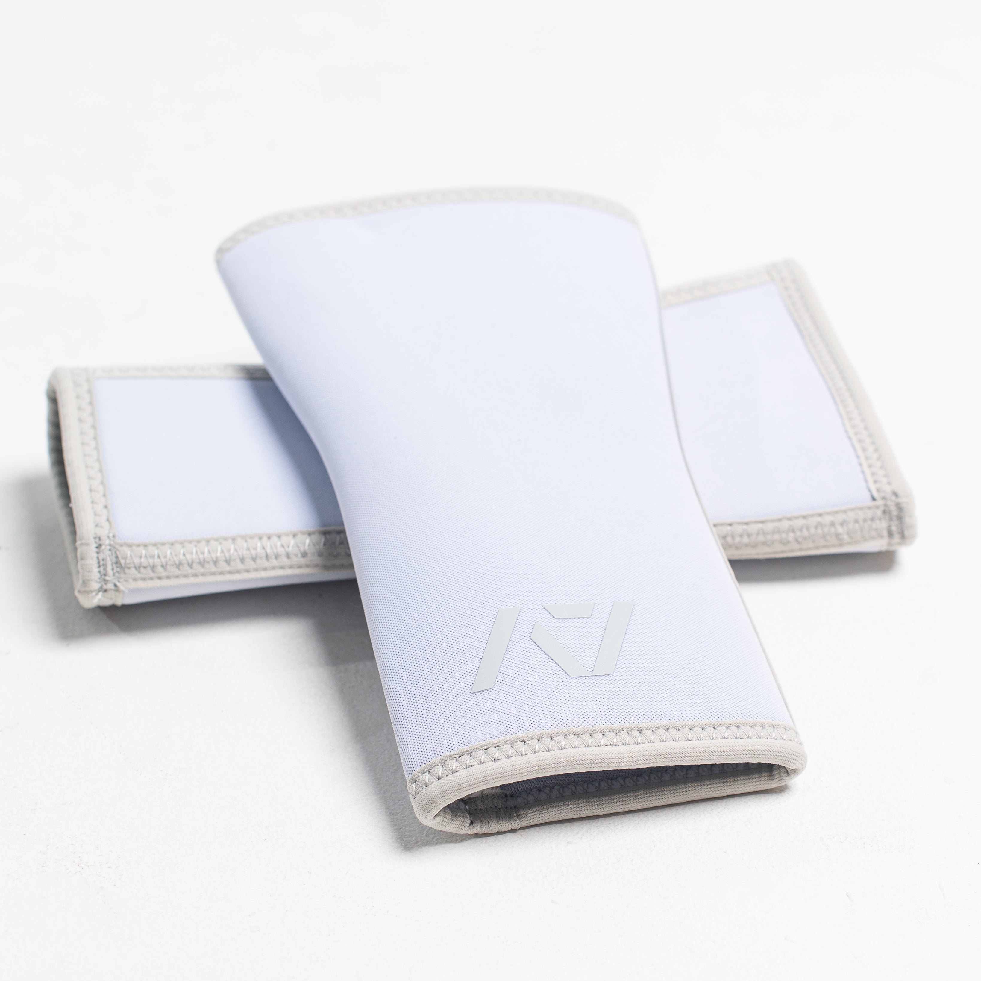 White Knee Sleeves with logo on a white background