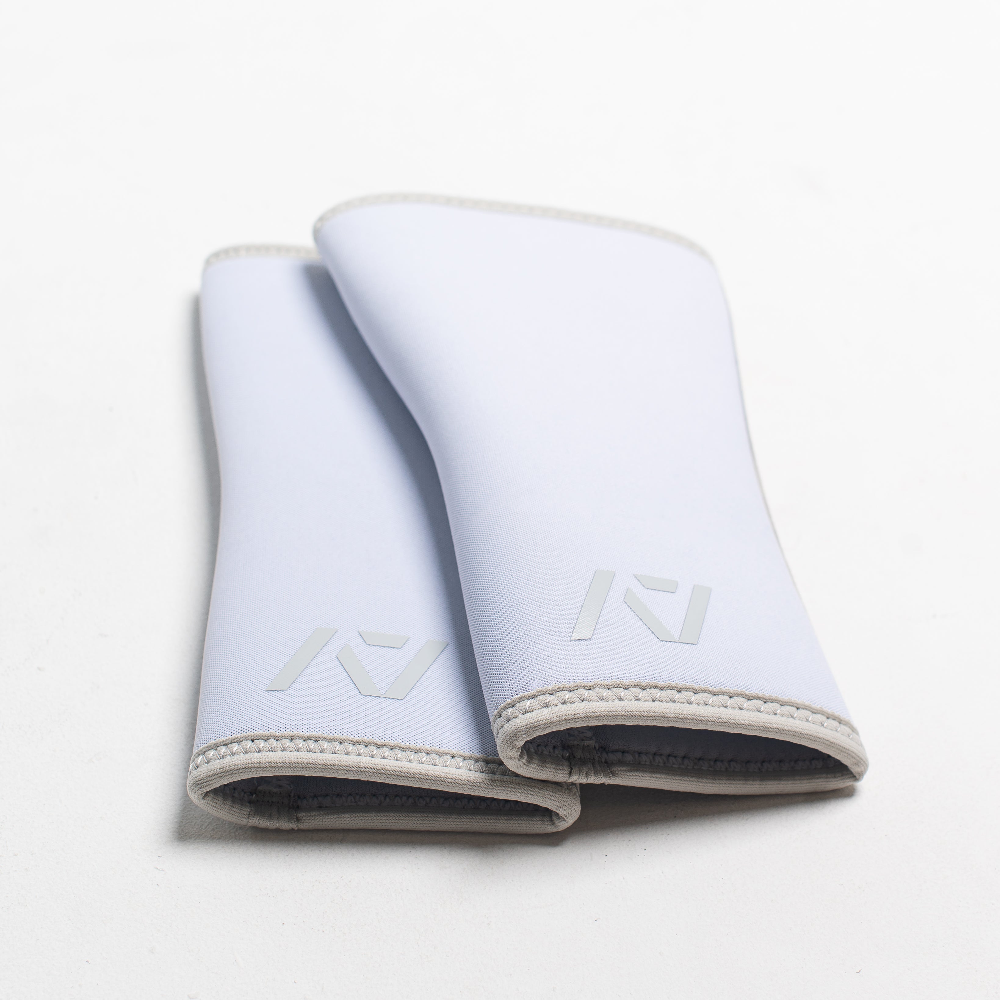 Flaylay of Knee Sleeves on white background together