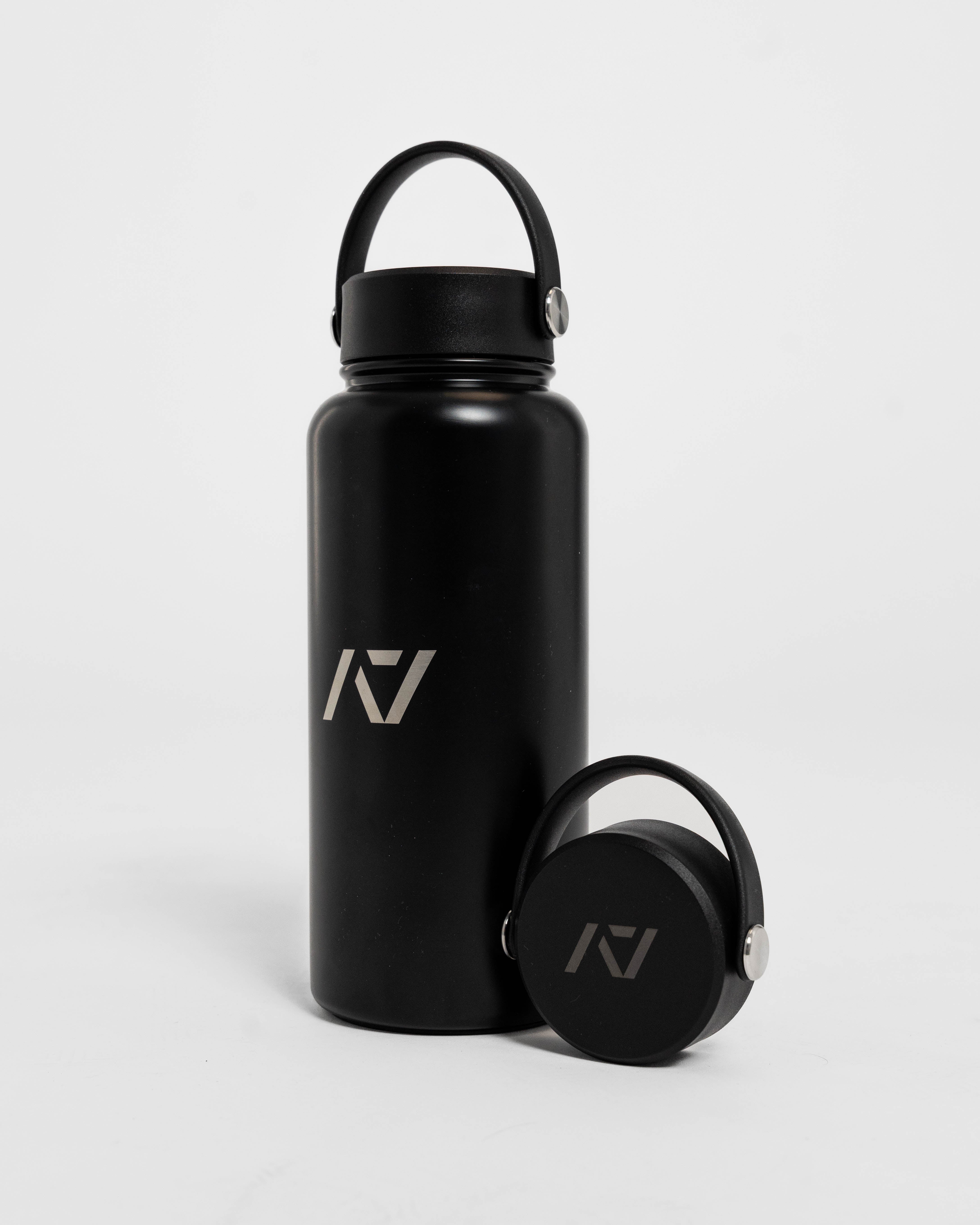 Black water bottle with a logo on a light gray background