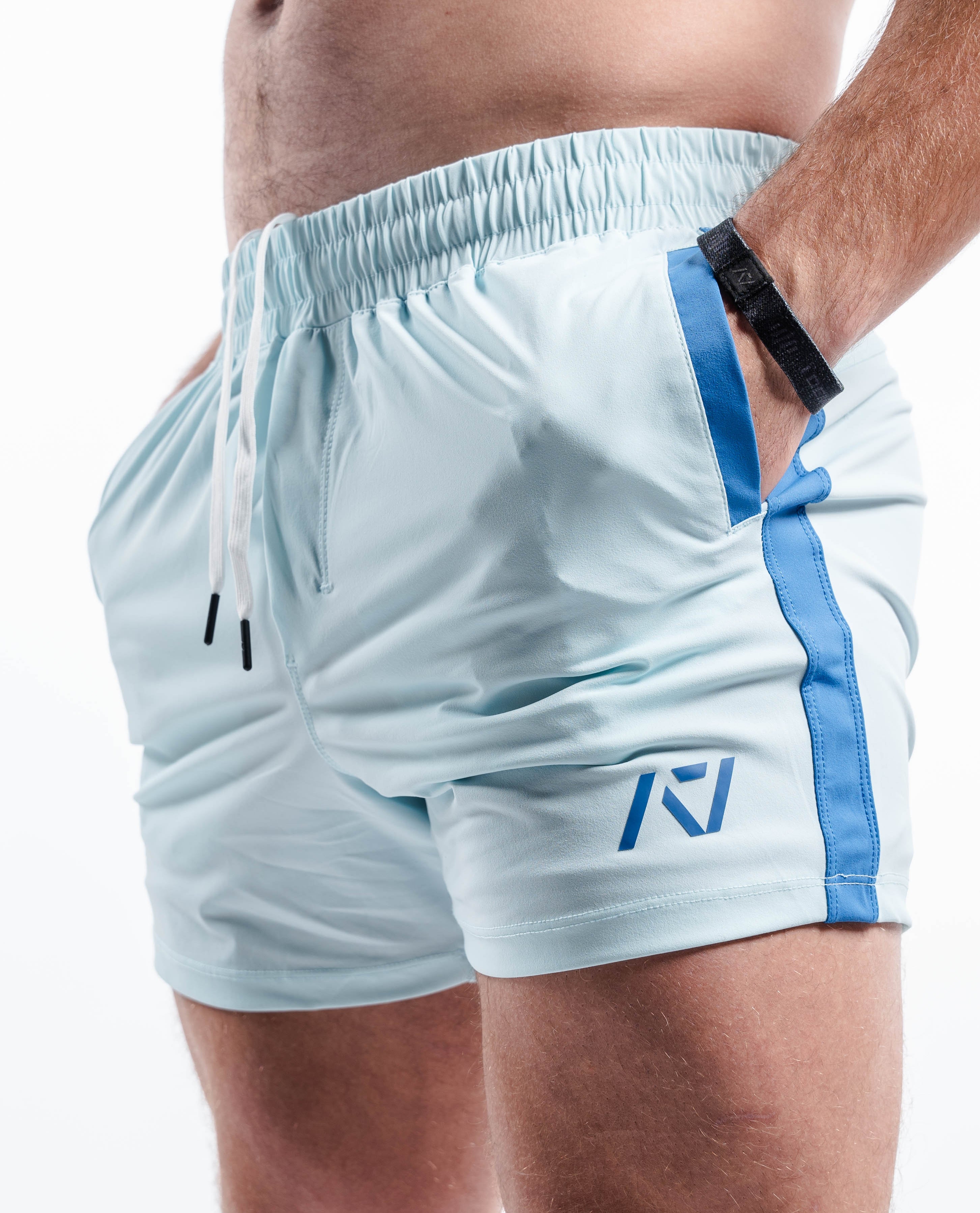 Side profile of Cyanite 360Go KWD Shorts featuring shorter inseam, flexible fit, and tapered cut.