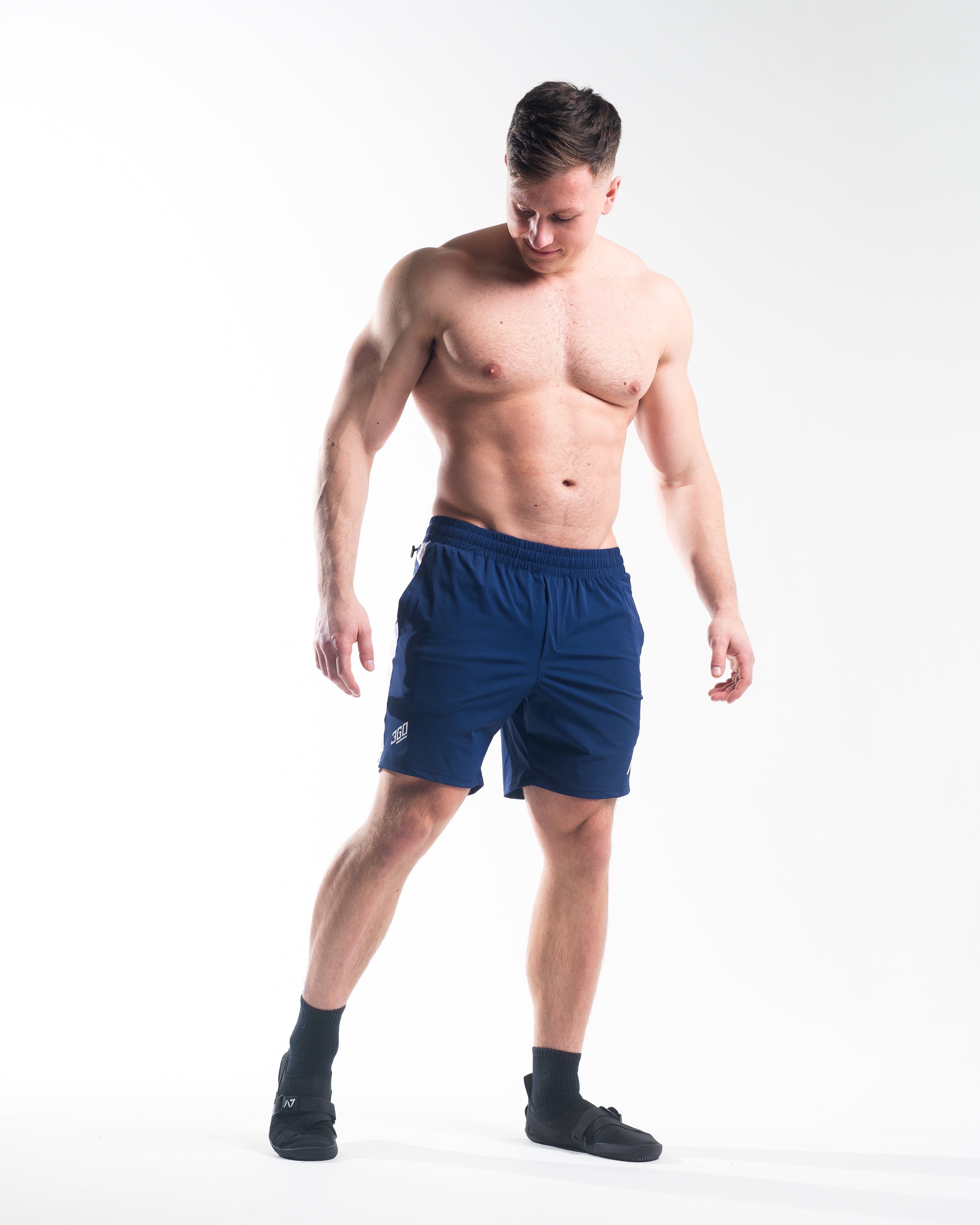Full body view of athlete wearing A7 360Go Regular Shorts in Night Light, highlighting bold contrast and athletic fit.