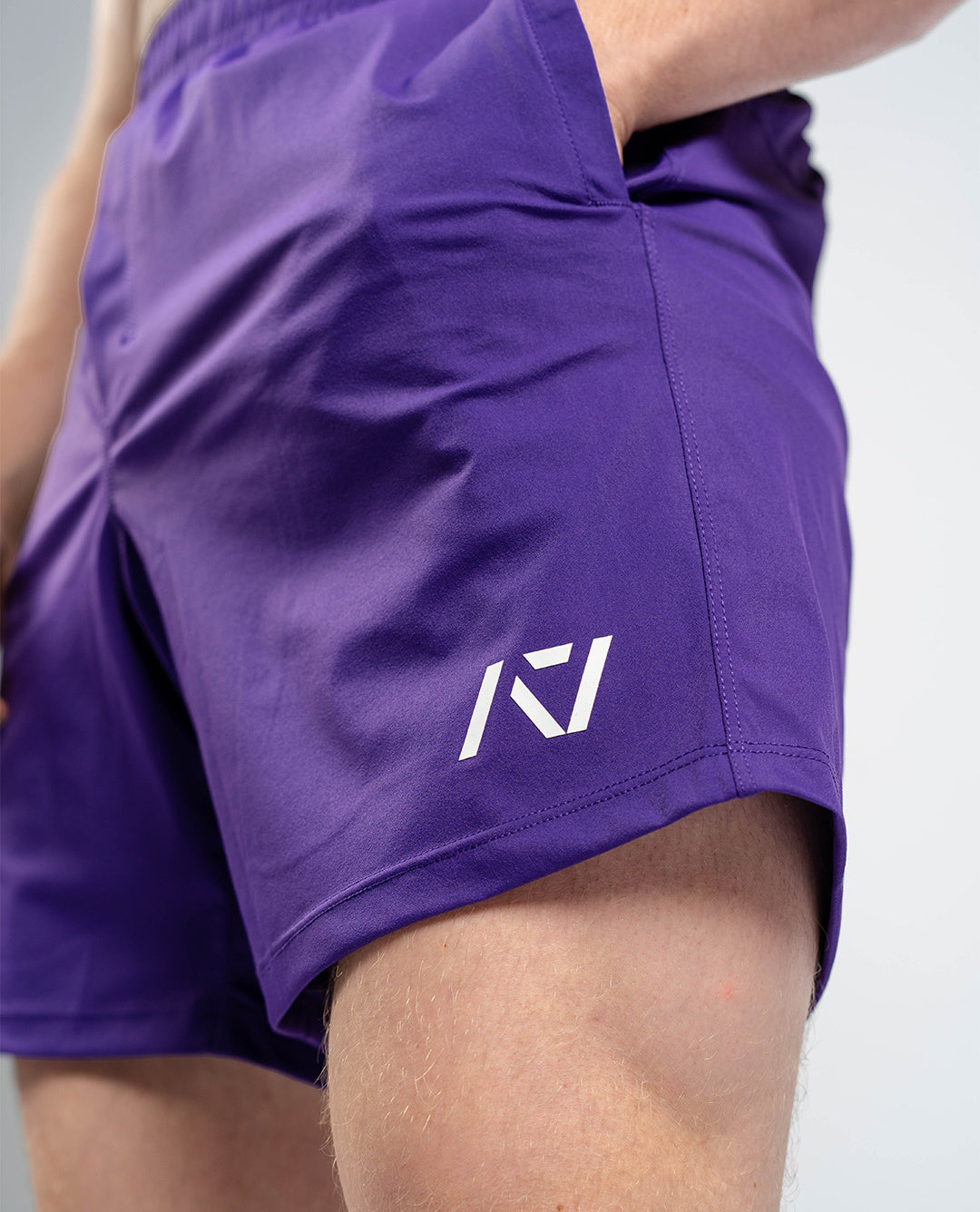 Matte silicone A7 logos on Purple 360Go Shorts offering subtle branding on a bold color base.