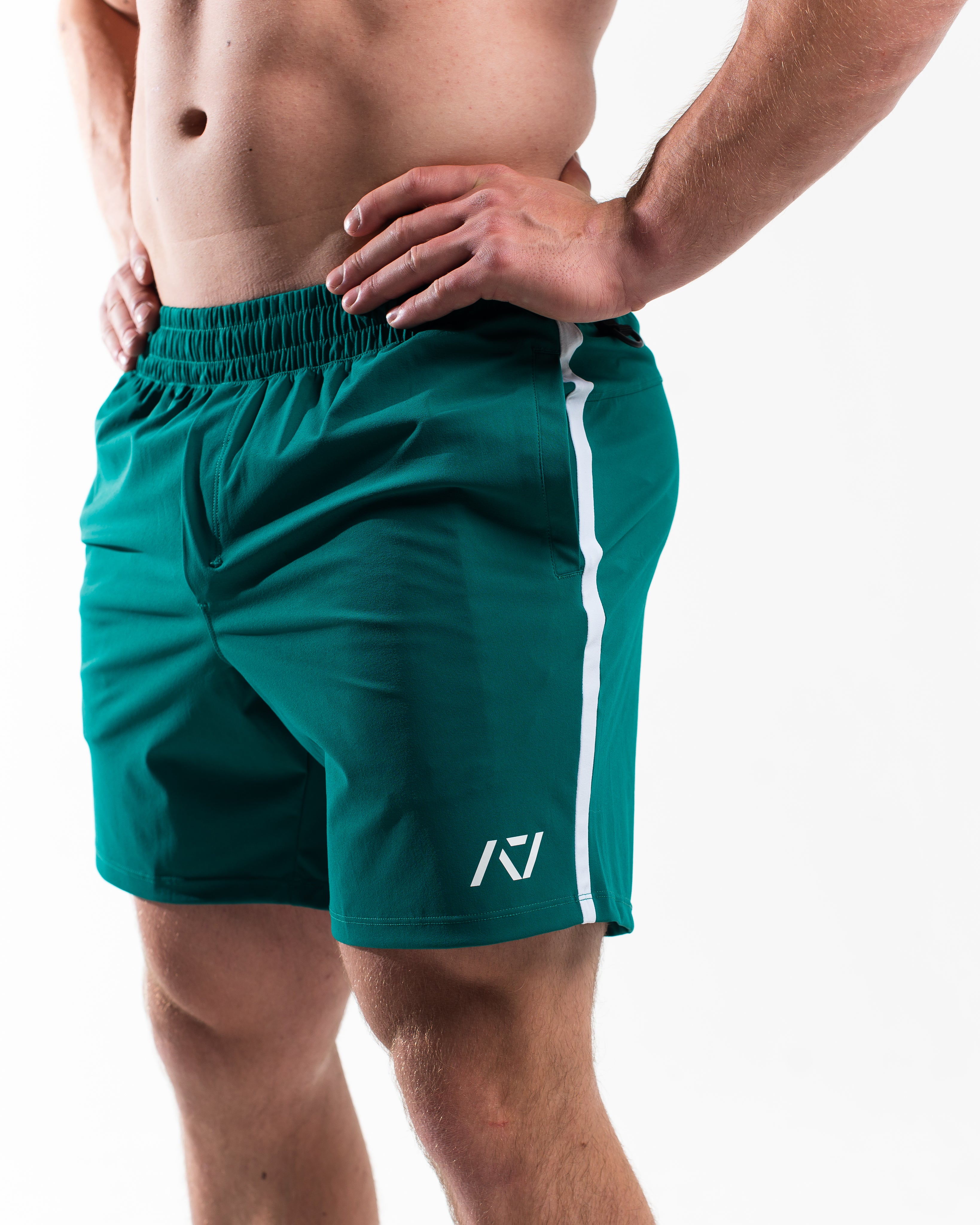 Matte silicone A7 logos on Terragreen 360Go Shorts for subtle, long-lasting branding on vibrant green fabric.