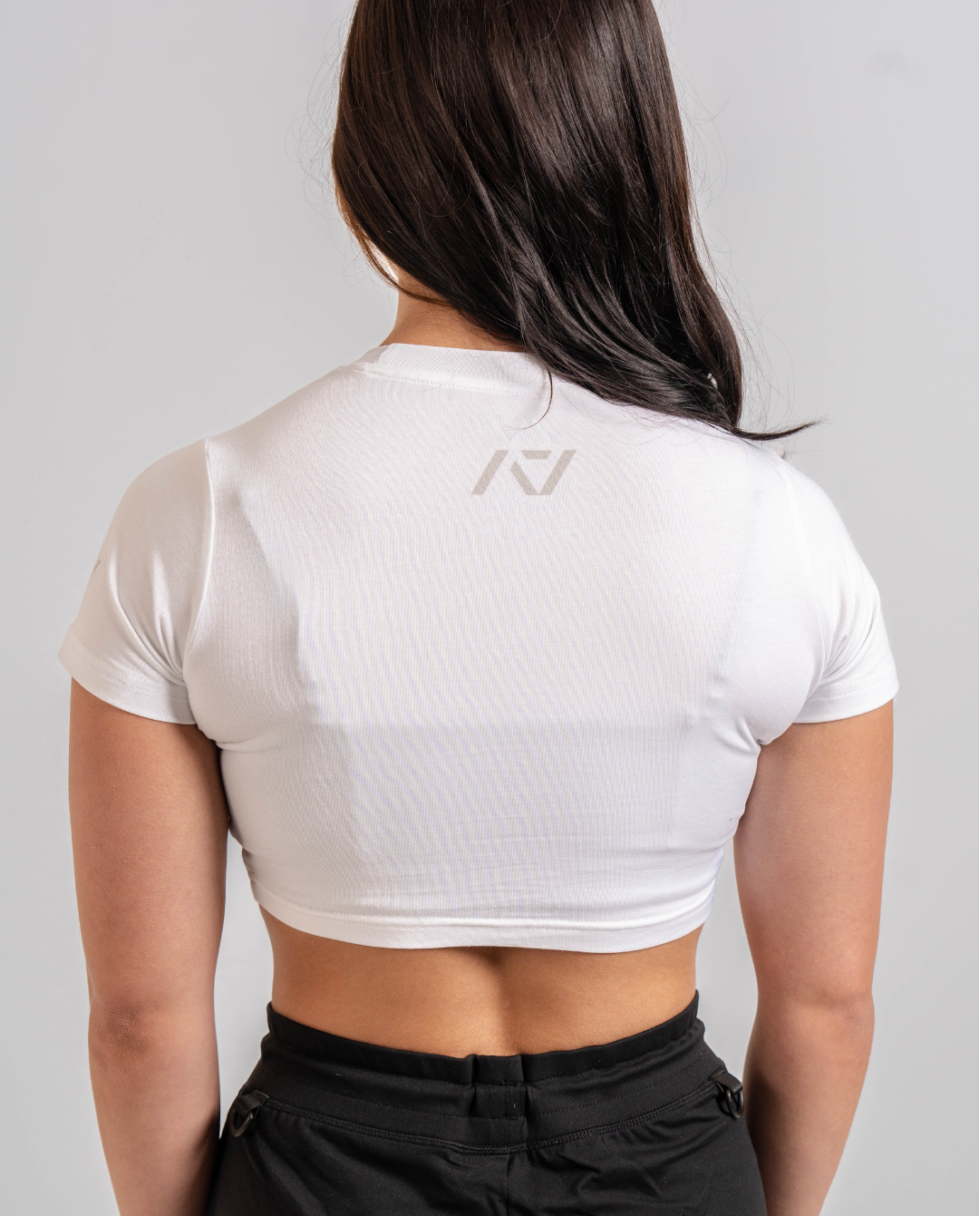 Back of the A7 Polar Meet Crop with A7 logo on the top of the upper back to be seen underneath singlet.
