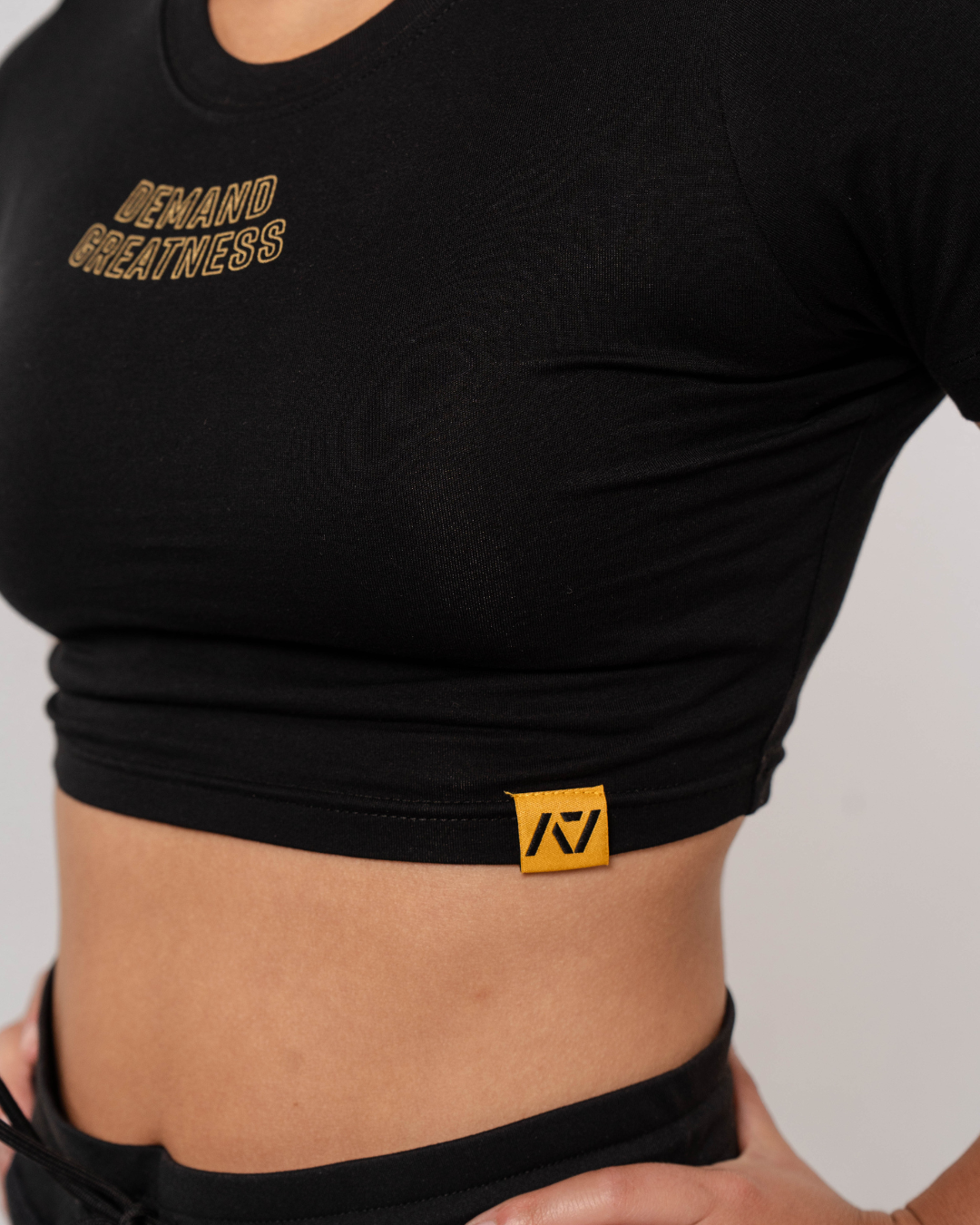 Demand Greatness True-Fit Women's Meet Crop - Gold Standard