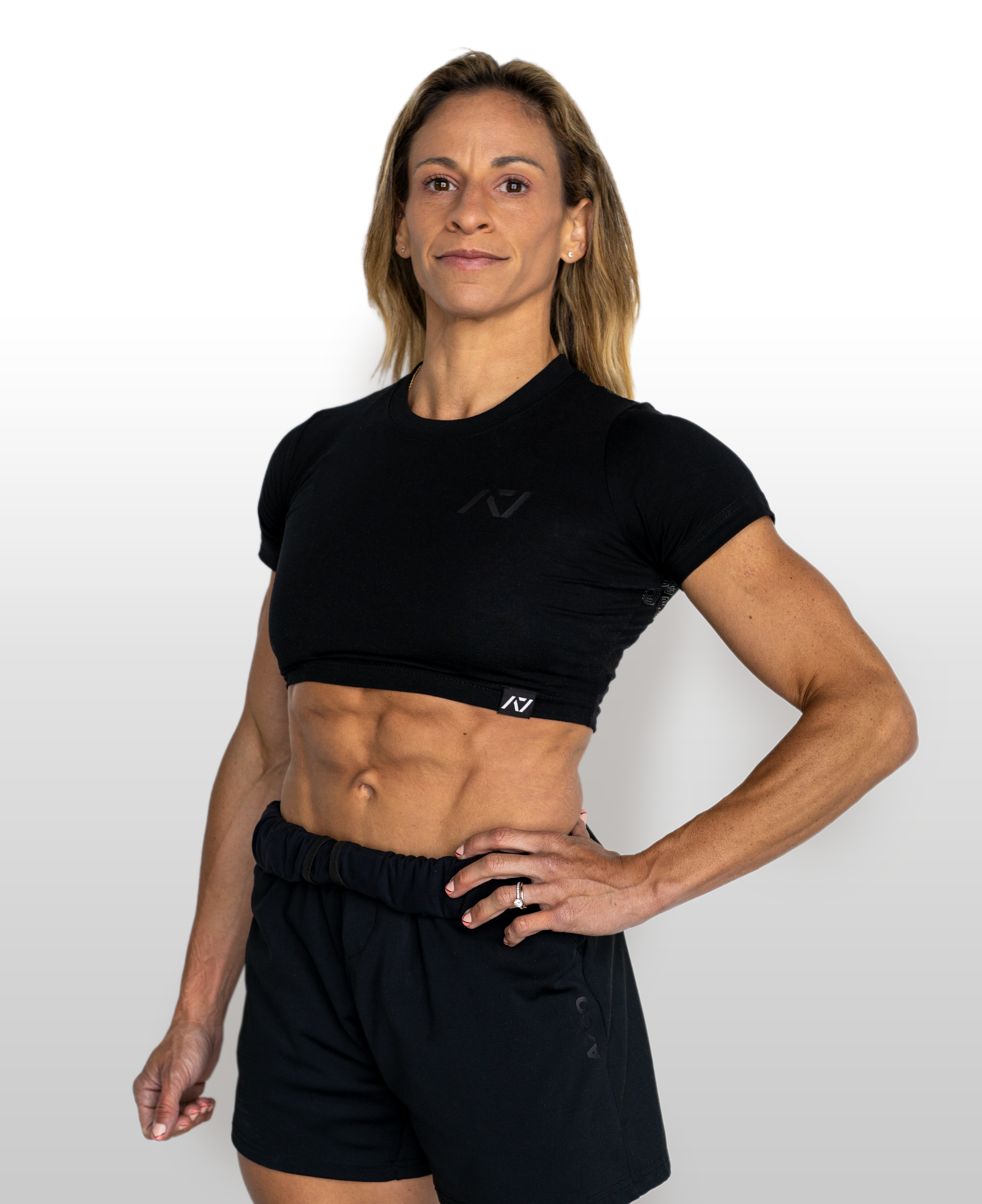 Person wearing a black athletic outfit on a white background