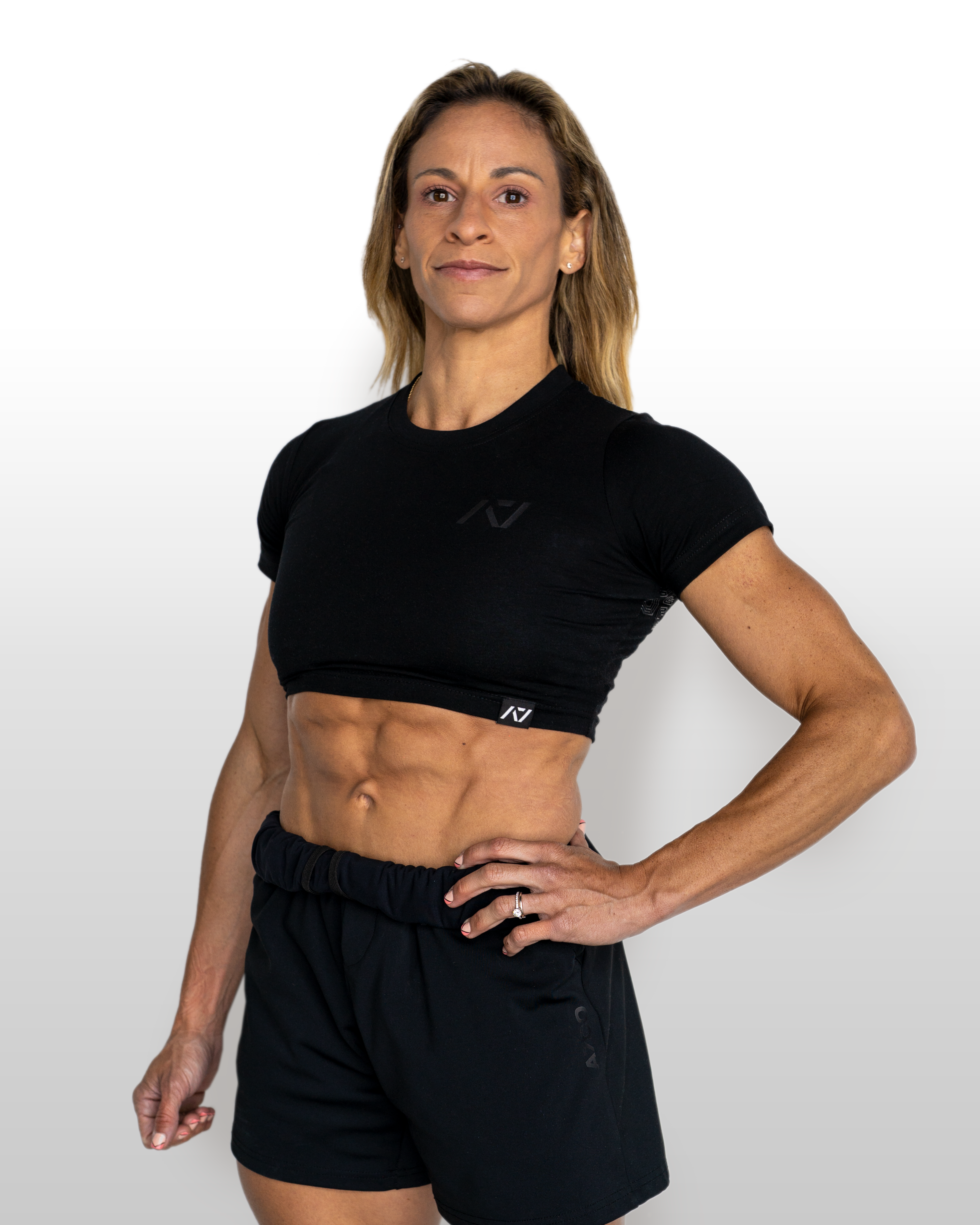 Person wearing a black athletic outfit on a white background