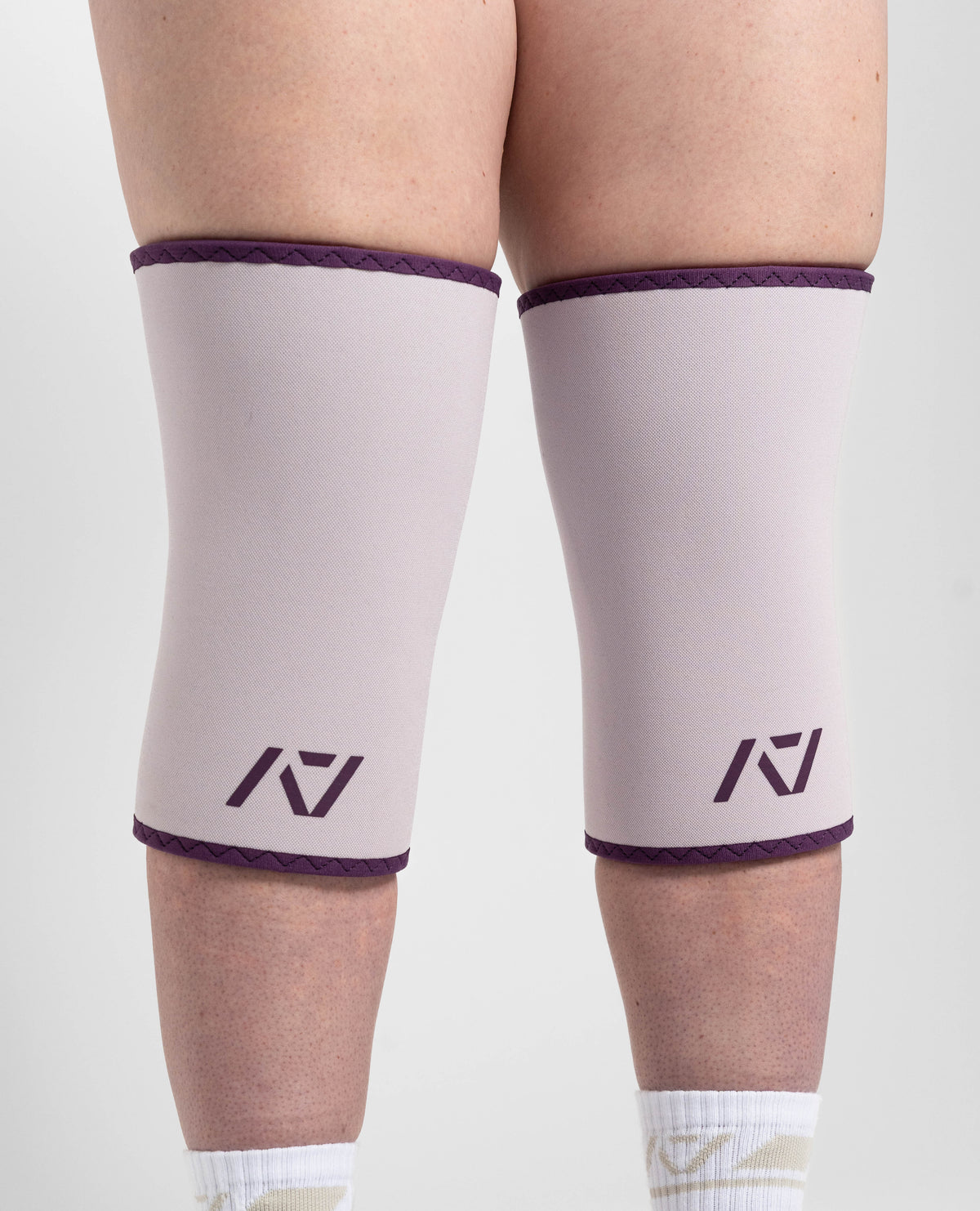 Close up of hourglass knee sleeves in Lavender on female