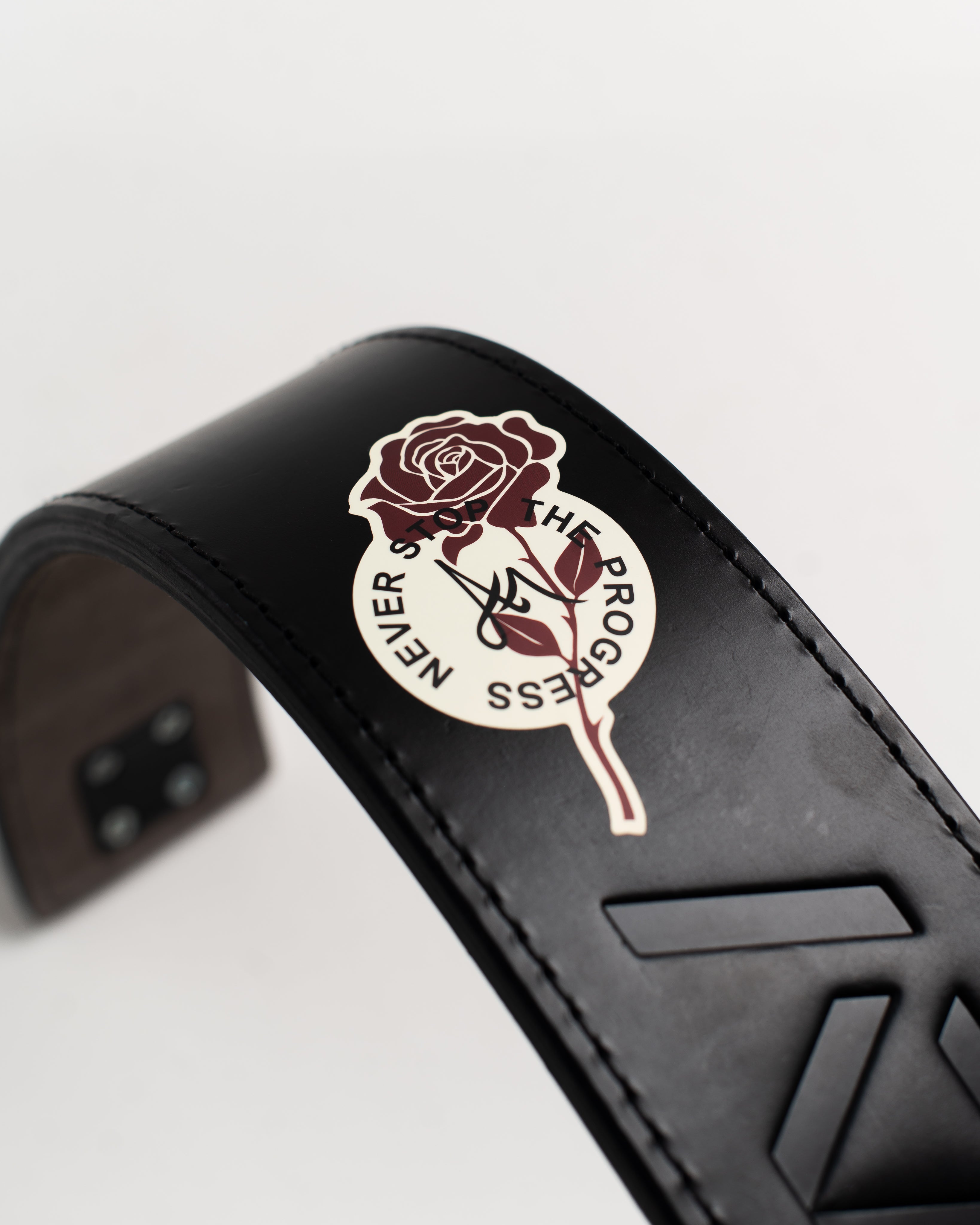 Ivory Rose Design with A7 sticker on a powerlifting belt