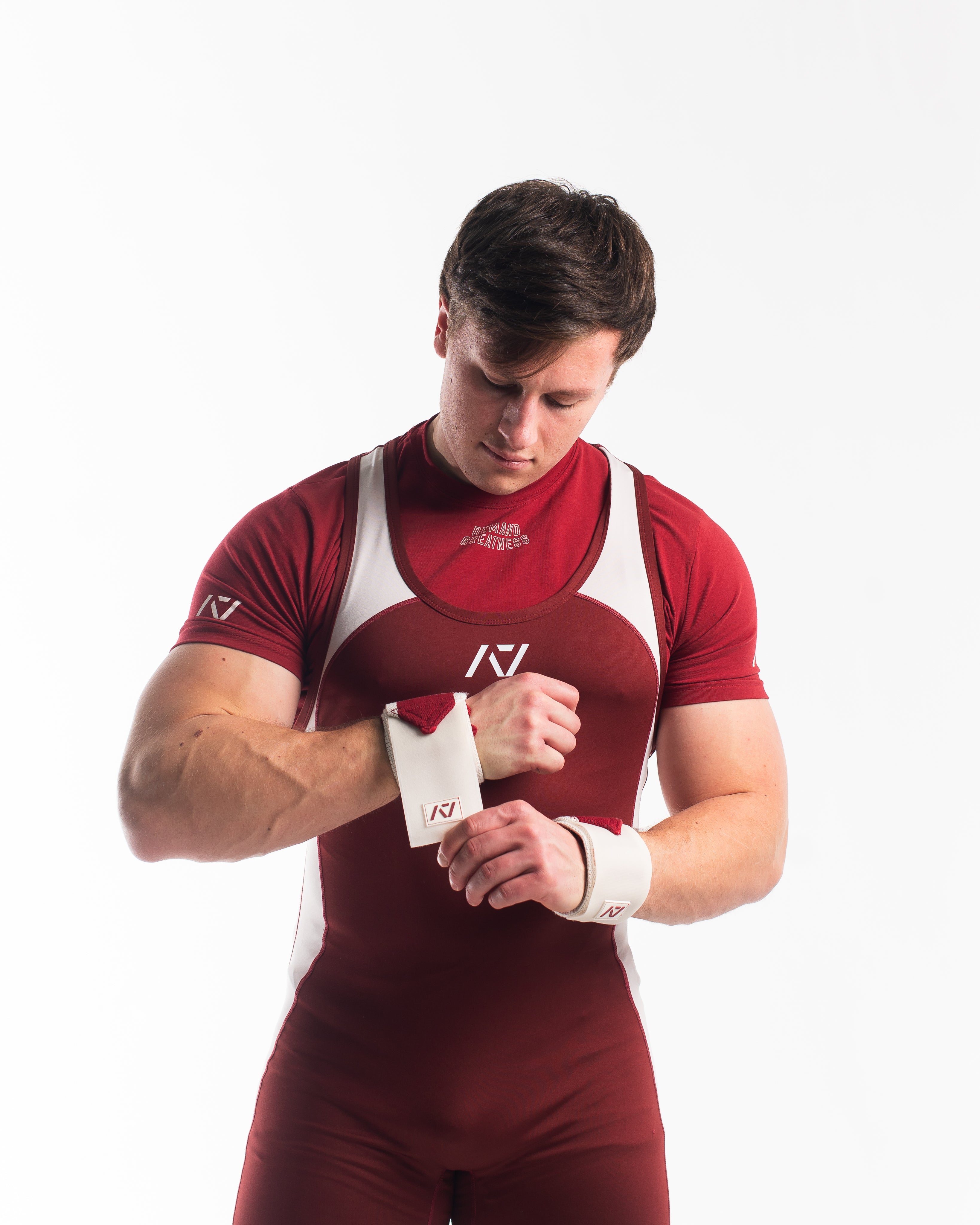 Male model in Ivory Rose Meet Kit putting on the Ivory Rose wrist wraps