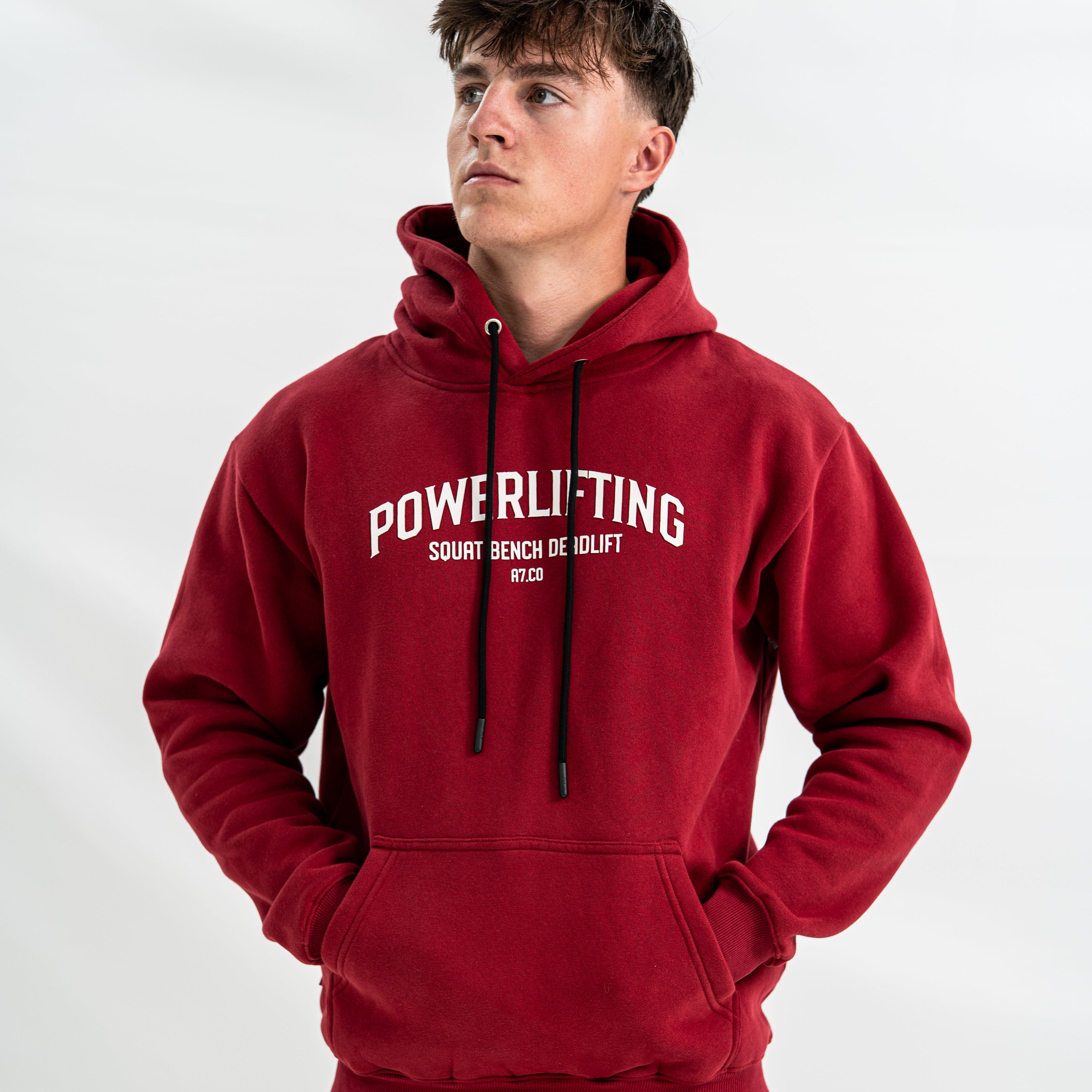 Male wearing a red Bar Grip hoodie with 'Powerlifting' text on a white background