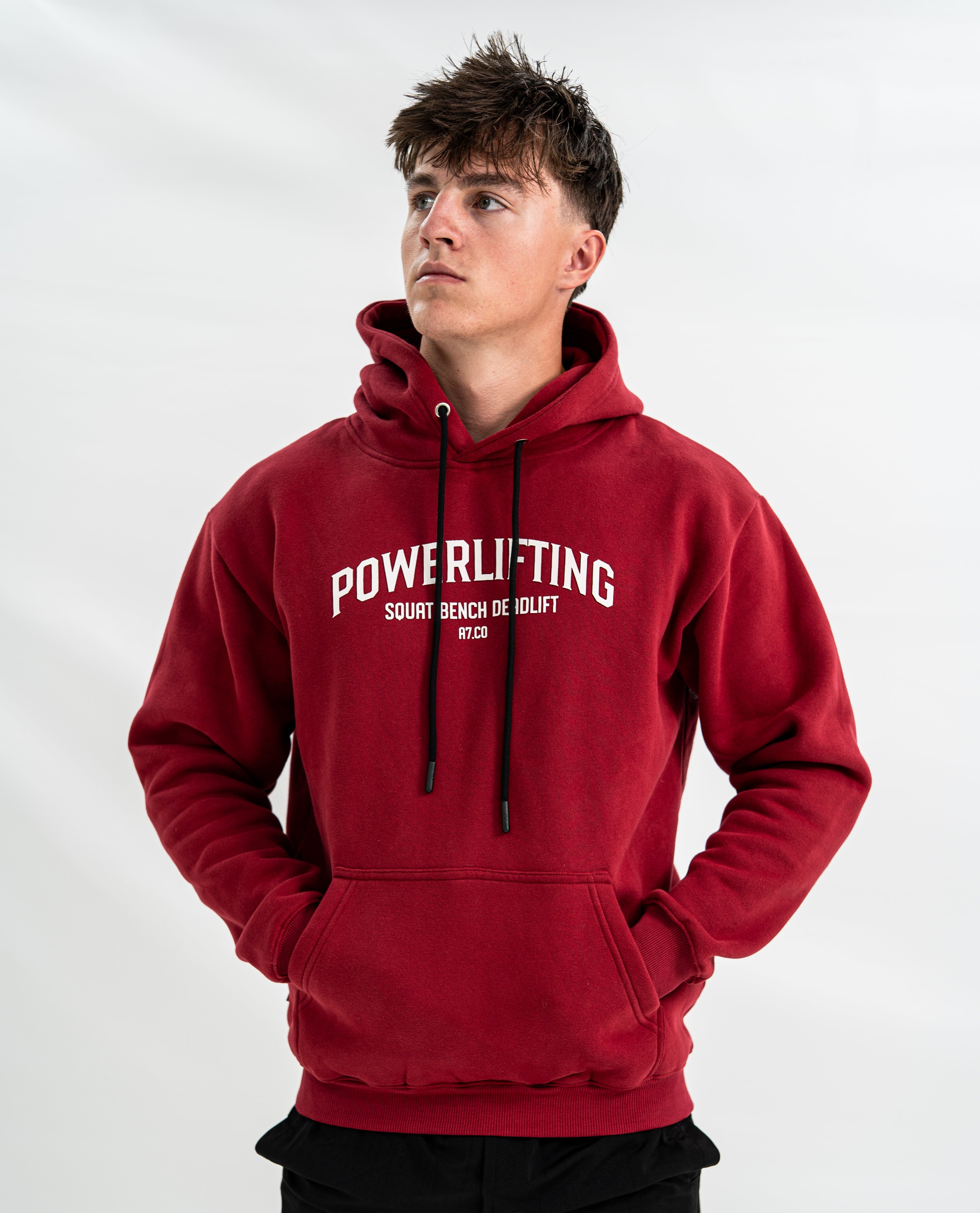 Male wearing a red Bar Grip hoodie with 'Powerlifting' text on a white background