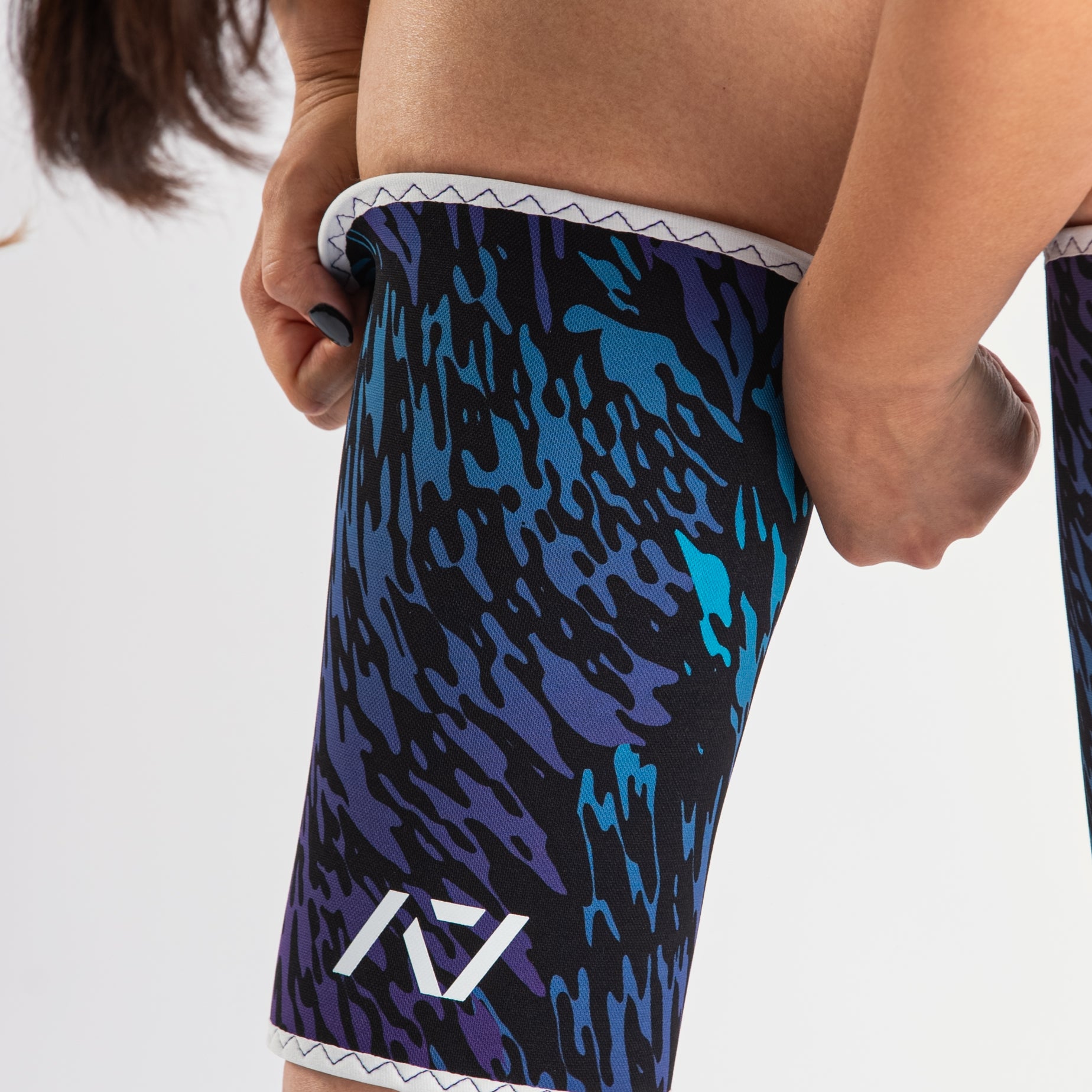 Close-up of A7 Hourglass Knee Sleeves – Rigor Mortis – Violet Tiger, displaying double-stitched seams and tiger print design.