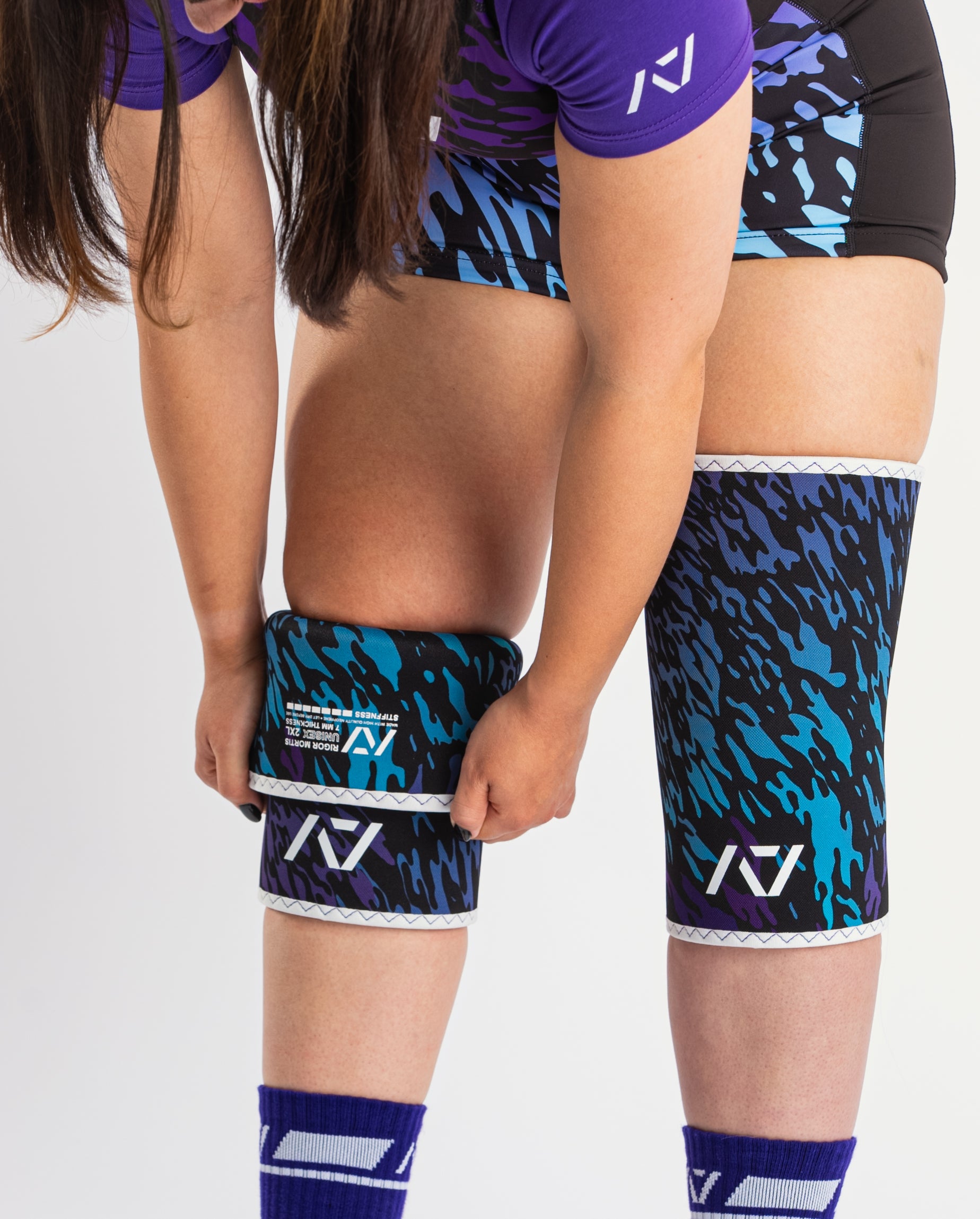 Full front view of the hourglass-shaped taper on A7 Knee Sleeves – Rigor Mortis – Violet Tiger, emphasizing targeted knee joint compression for powerlifting.