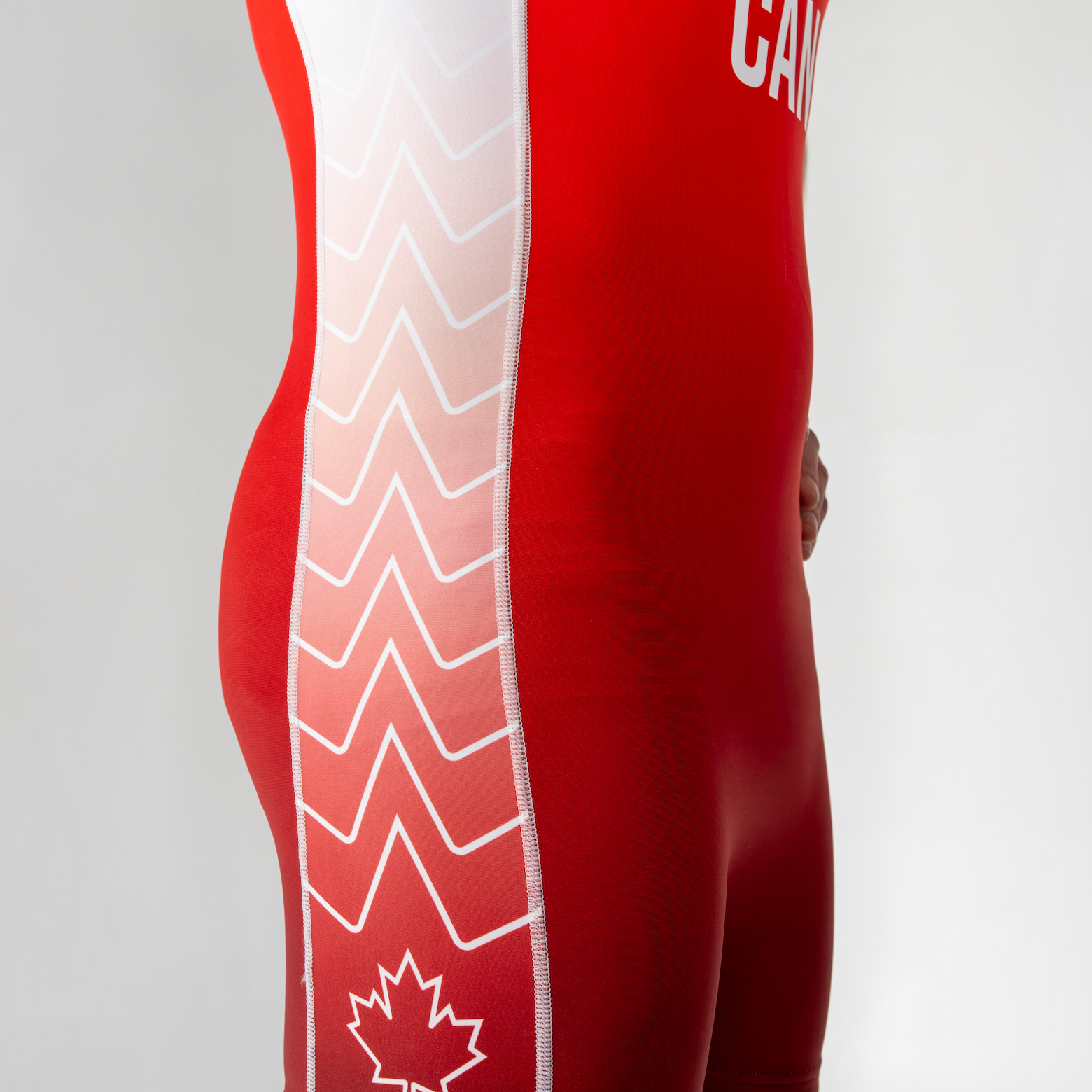 Red singlet with white patterns and 'Canada' text on a plain background