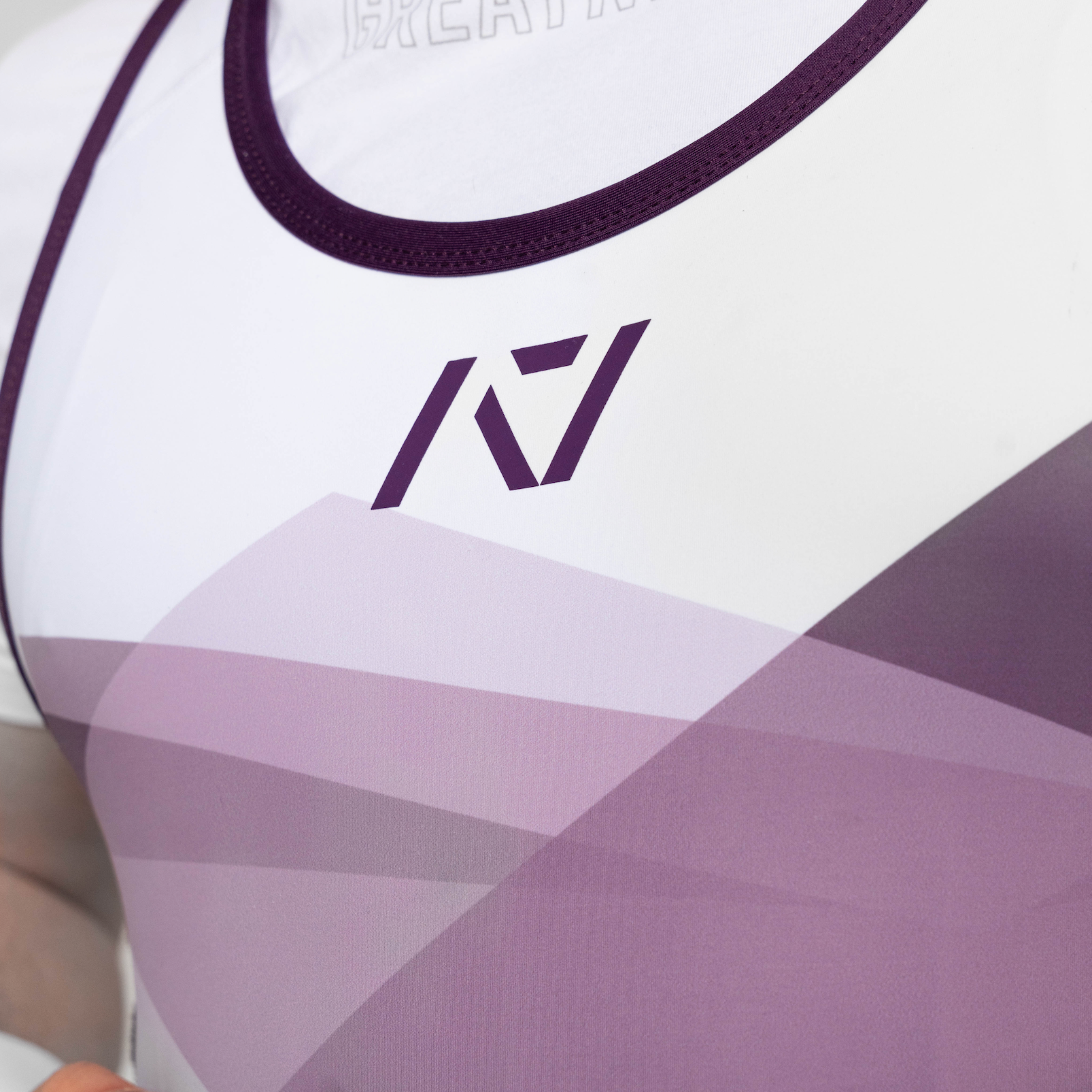 Close up of color and pattern on the front of the Rausch Singlet in Lavender on male model
