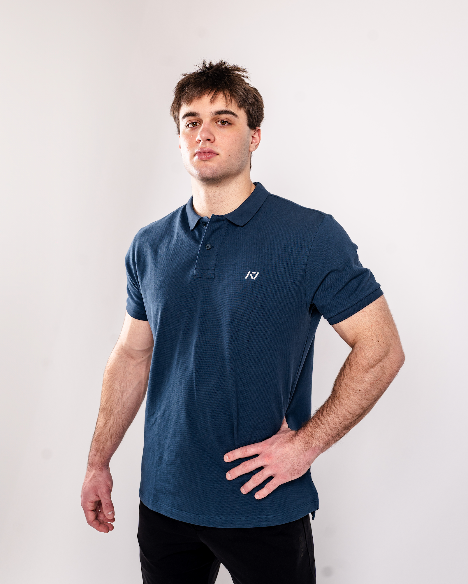 Front view of A7 Cotton Polo in Tides Blue, showcasing athletic fit and rib-knit collar.