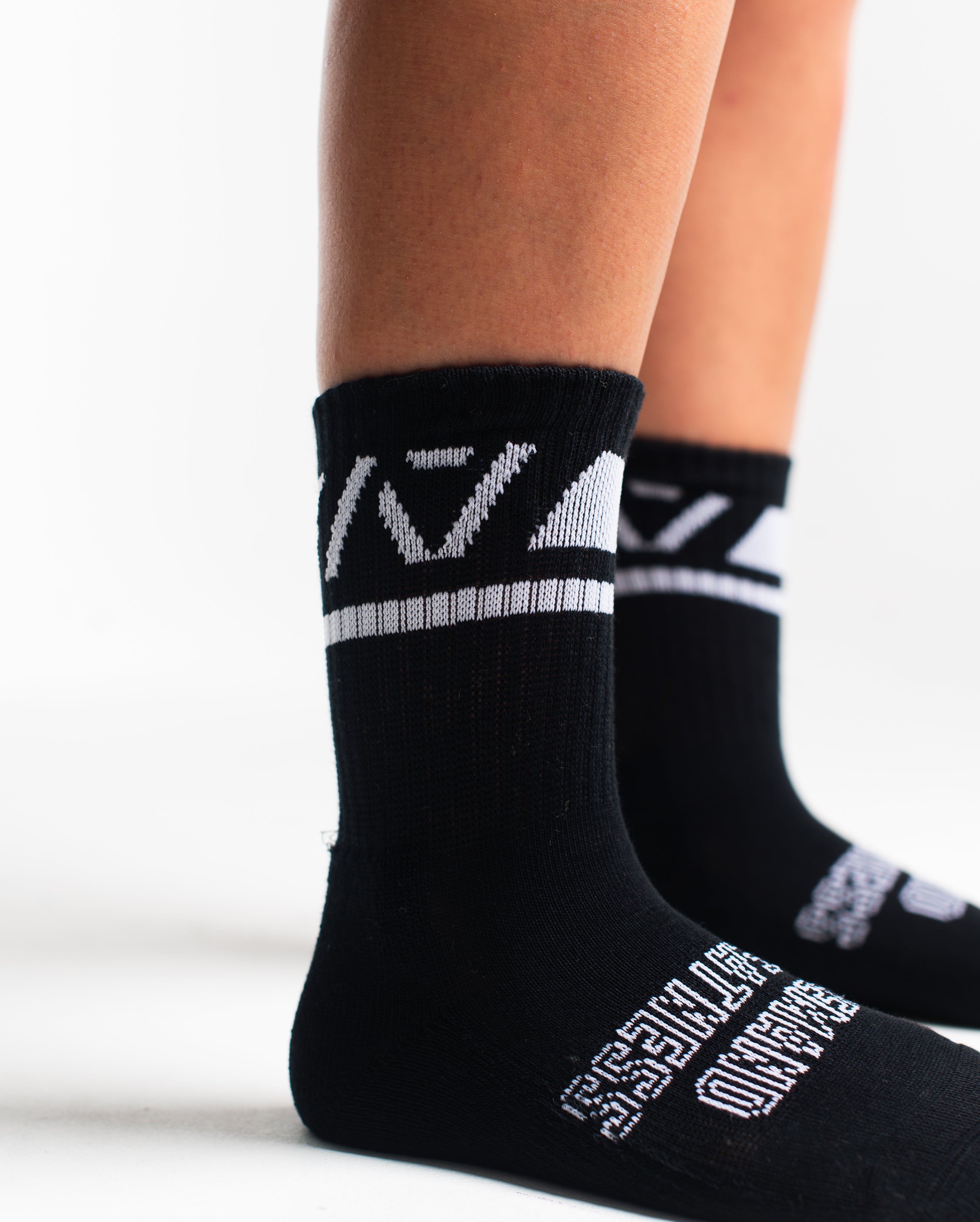 Close-up of the knit fabric on A7 Crew Socks in Black Domino, showing texture and stitching details.