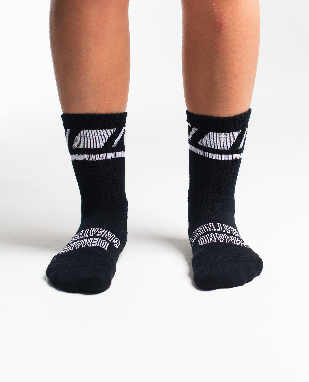 Front view of A7 Crew Socks in Black Domino, showcasing mid-shin length and ribbed cuff design.