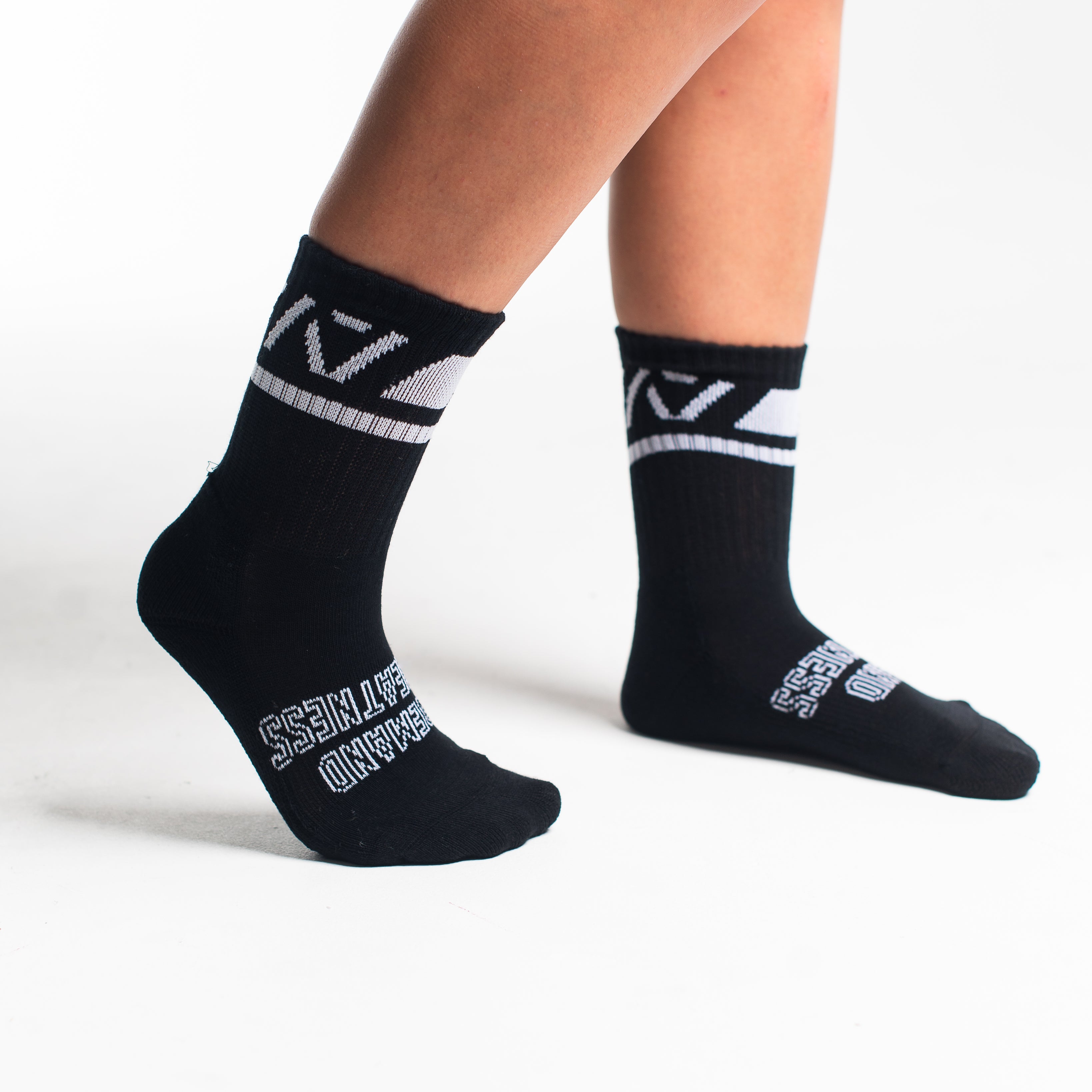 Side profile of A7 Crew Socks in Black Domino, highlighting the A7 logo on the ankle and compression-style top