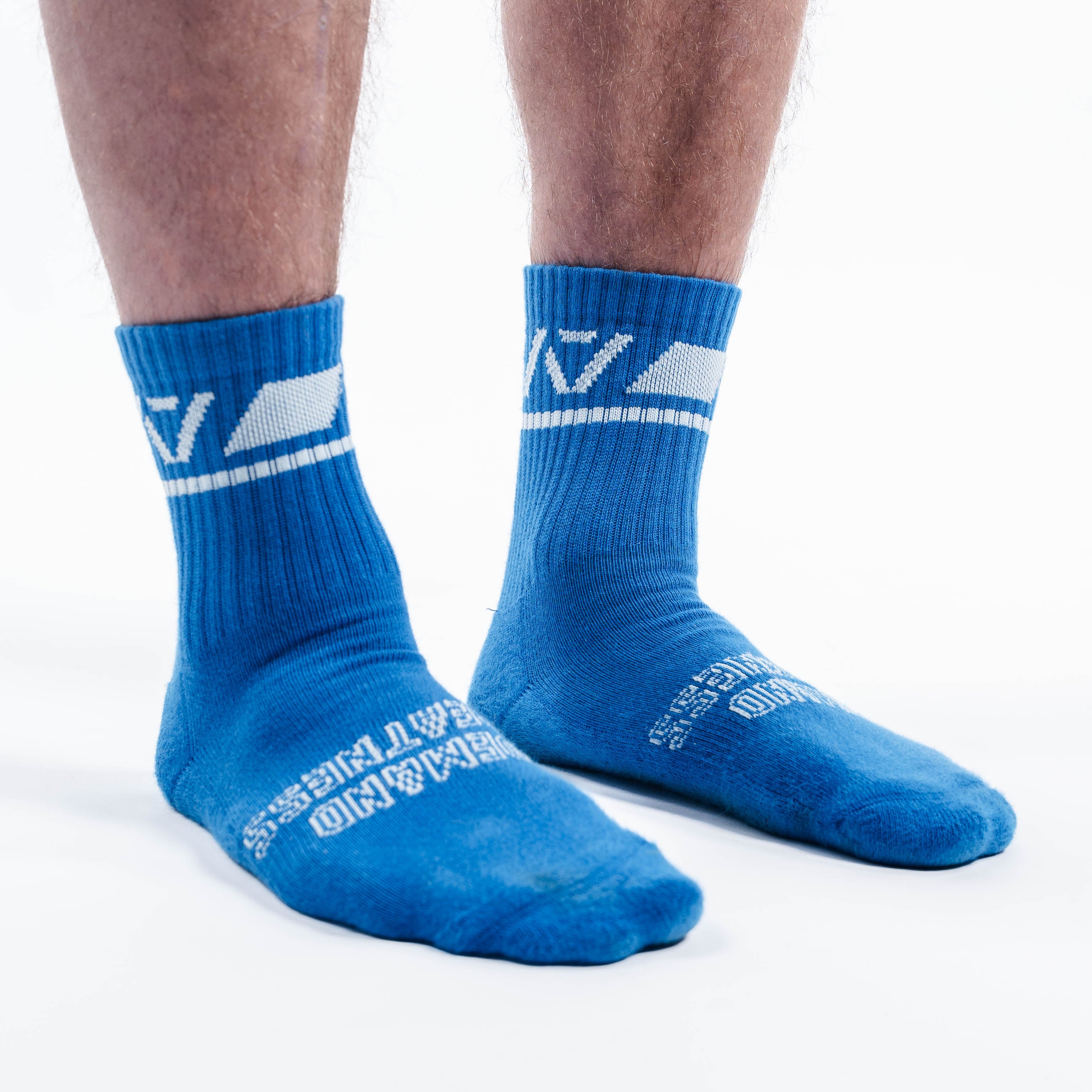 Side profile of A7 Crew Socks in Cyanite showing compression-style fit and contrast pink branding.