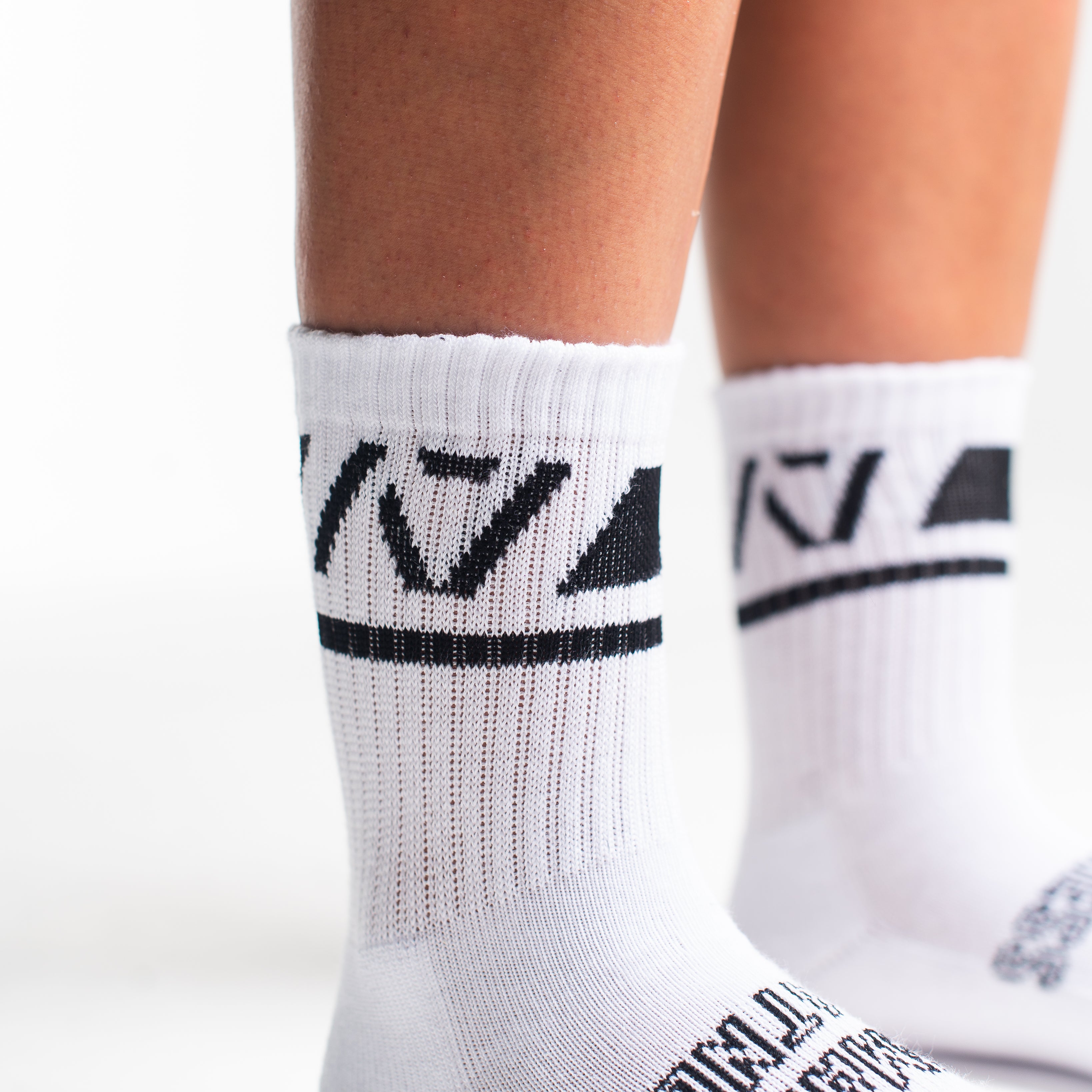 Close-up of the knit fabric on A7 Crew Socks in Domino White, showing texture and stitching details.