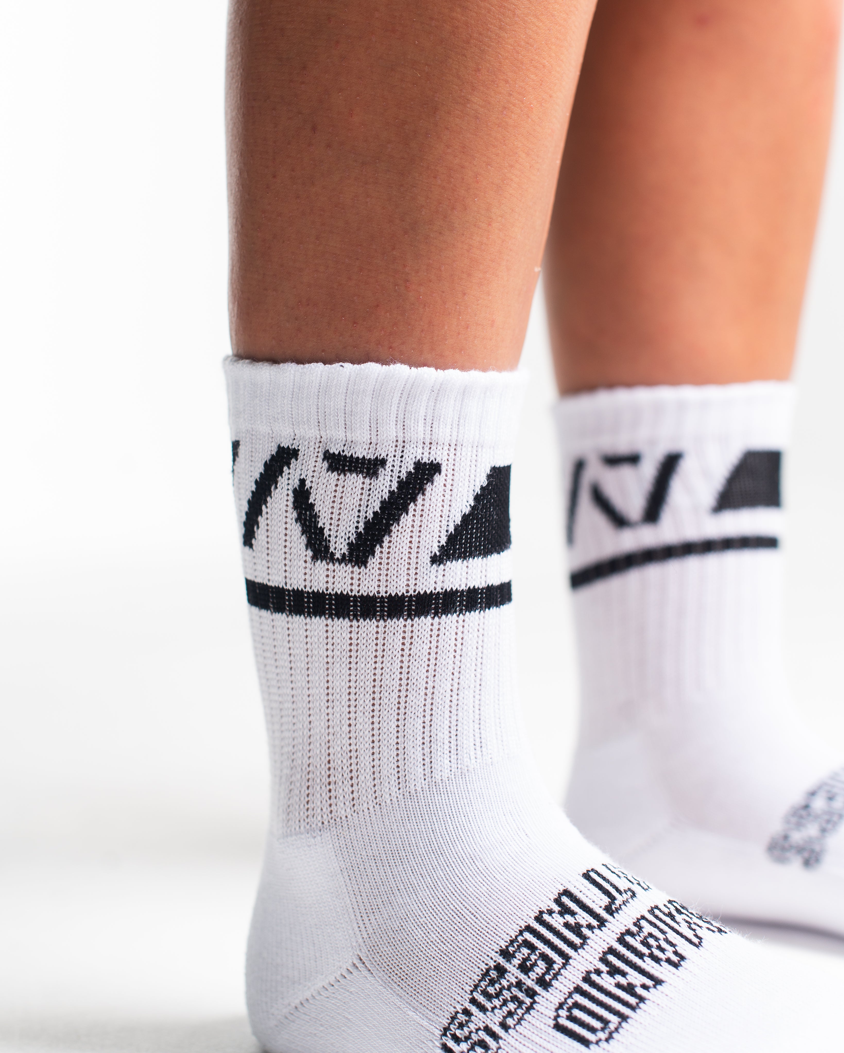 Close-up of the knit fabric on A7 Crew Socks in Domino White, showing texture and stitching details.
