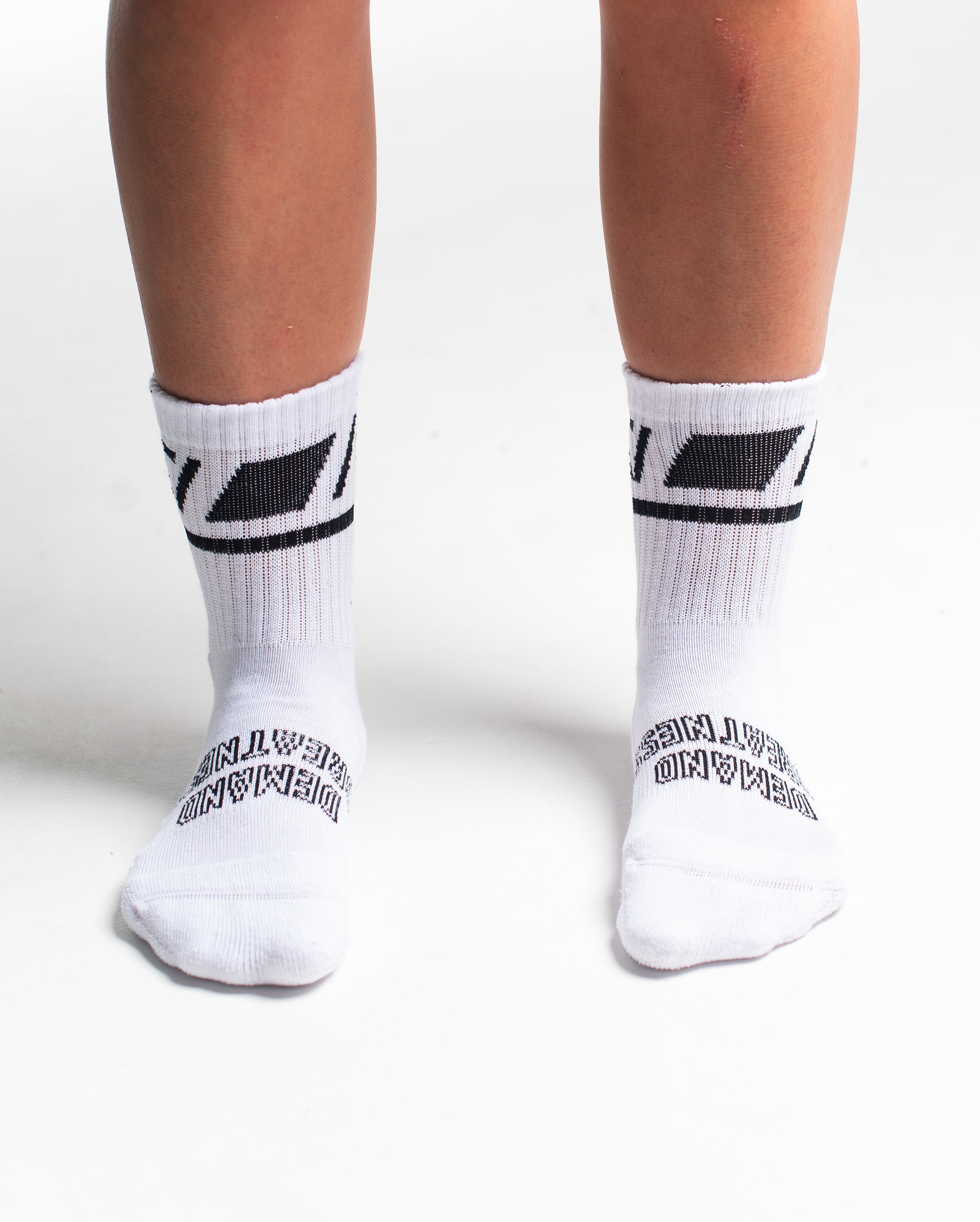 Front view of A7 Crew Socks in Domino White, showcasing mid-shin length and ribbed cuff design.