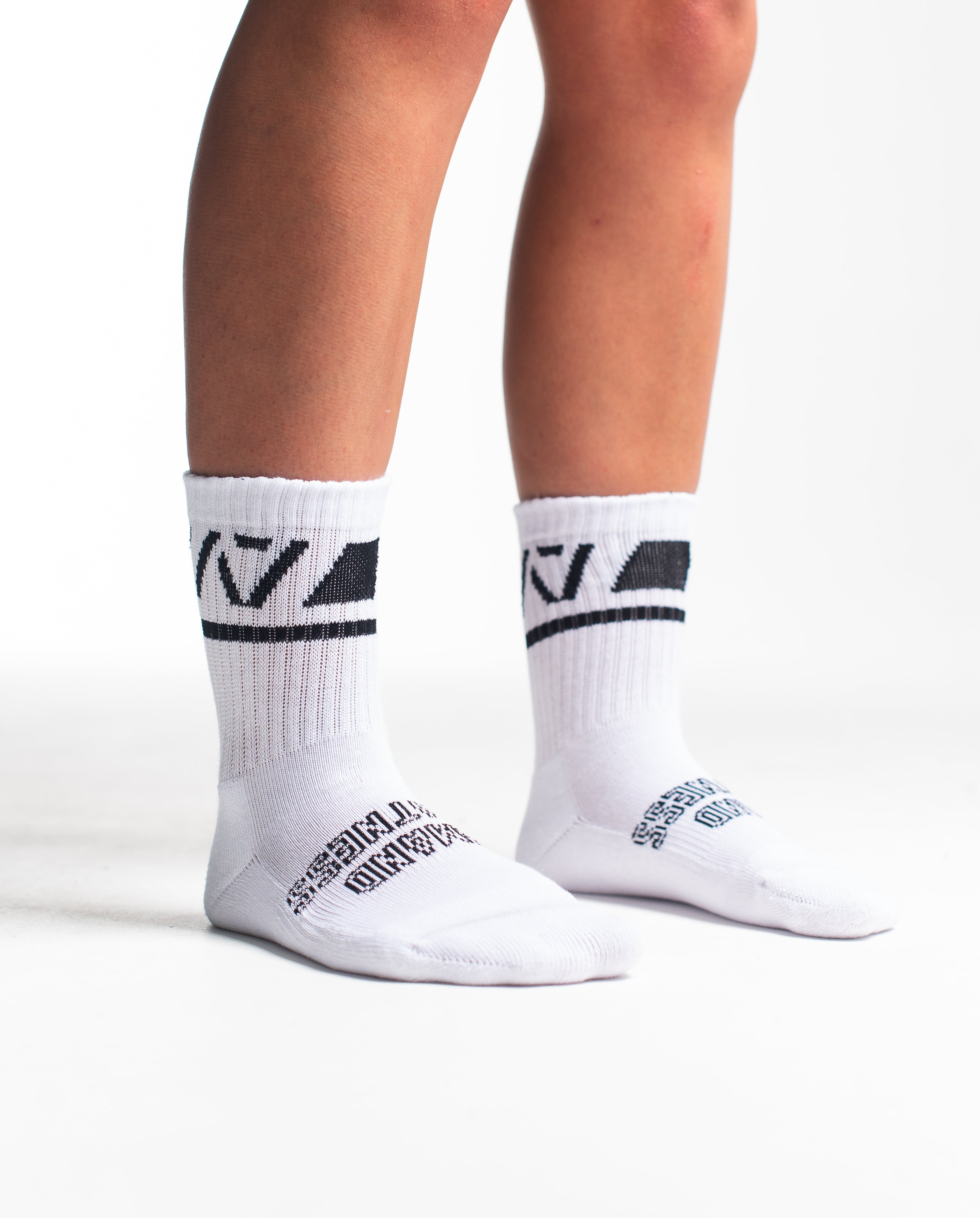 Side profile of A7 Crew Socks in Domino White, highlighting the A7 logo on the ankle and compression-style top.
