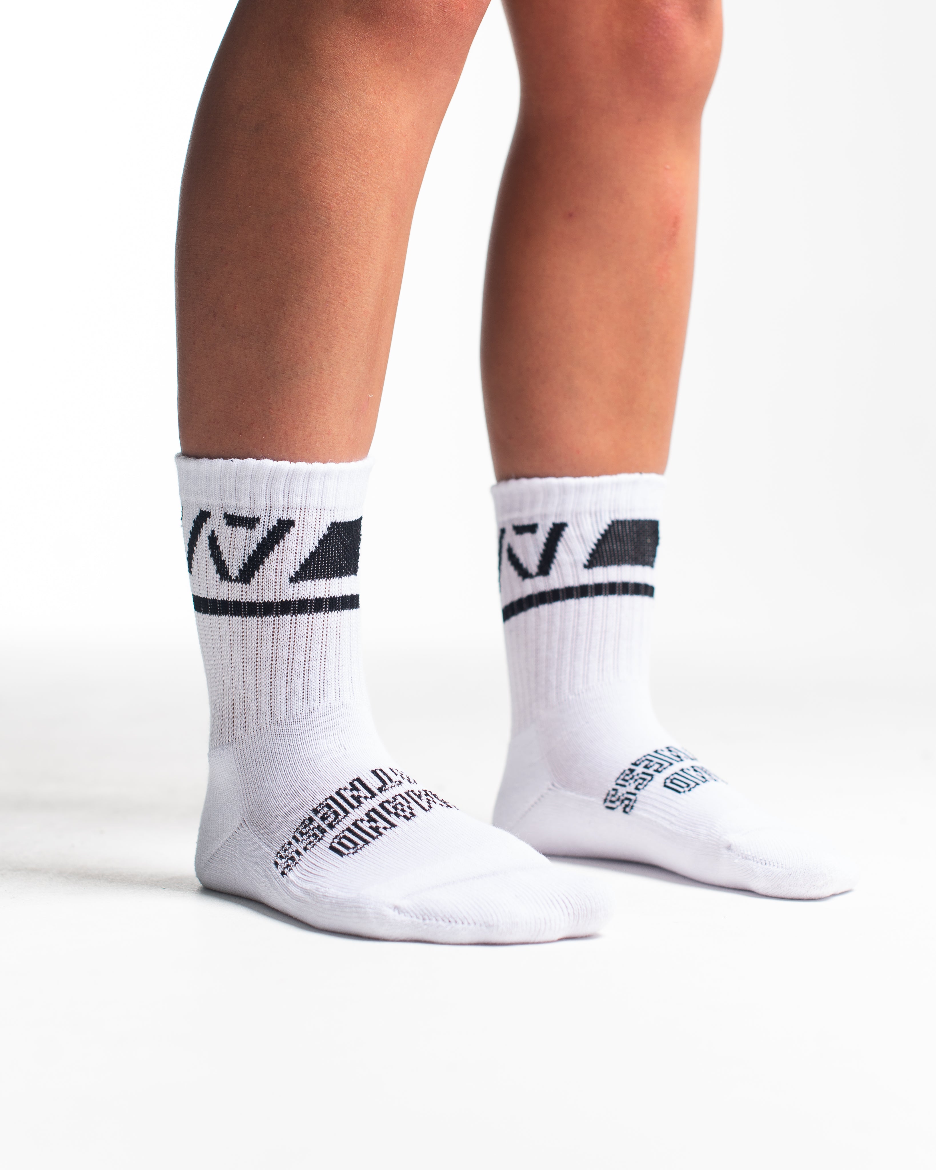 Side profile of A7 Crew Socks in Domino White, highlighting the A7 logo on the ankle and compression-style top.