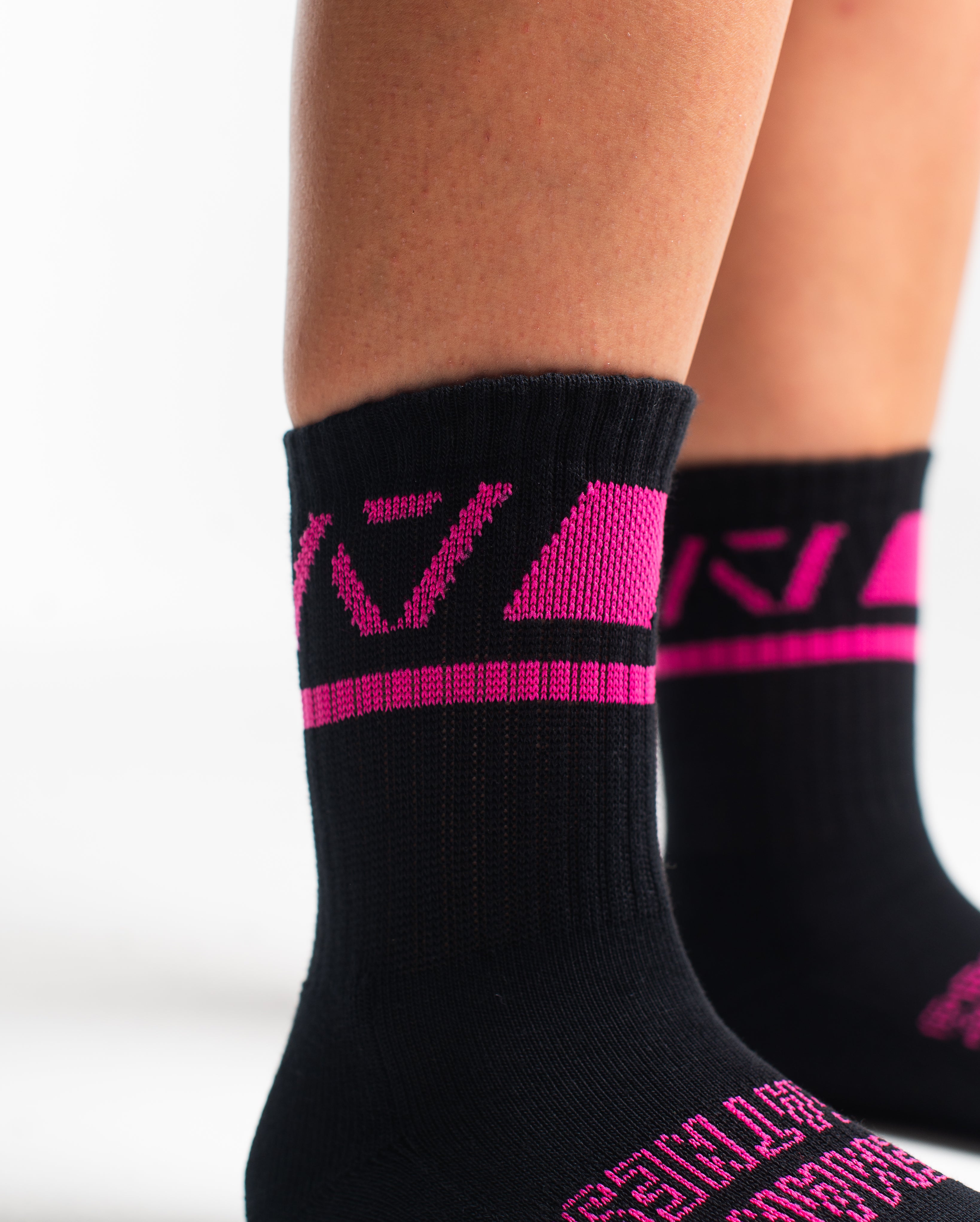 Close-up of the knit fabric on A7 Crew Socks in Flamingo, showing texture and stitching details.