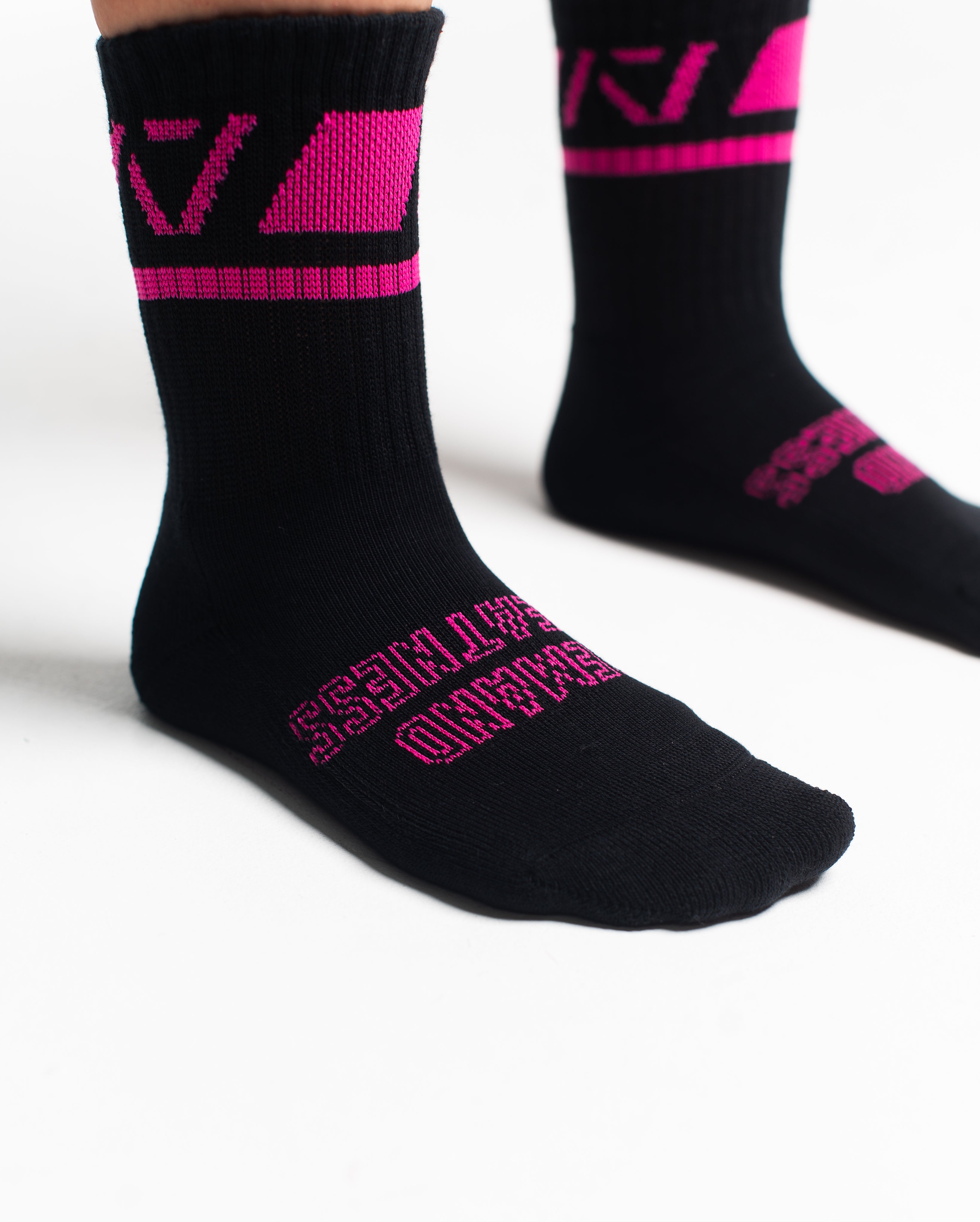 Close-up of the knit fabric on A7 Crew Socks in Flamingo, showing texture and stitching details.