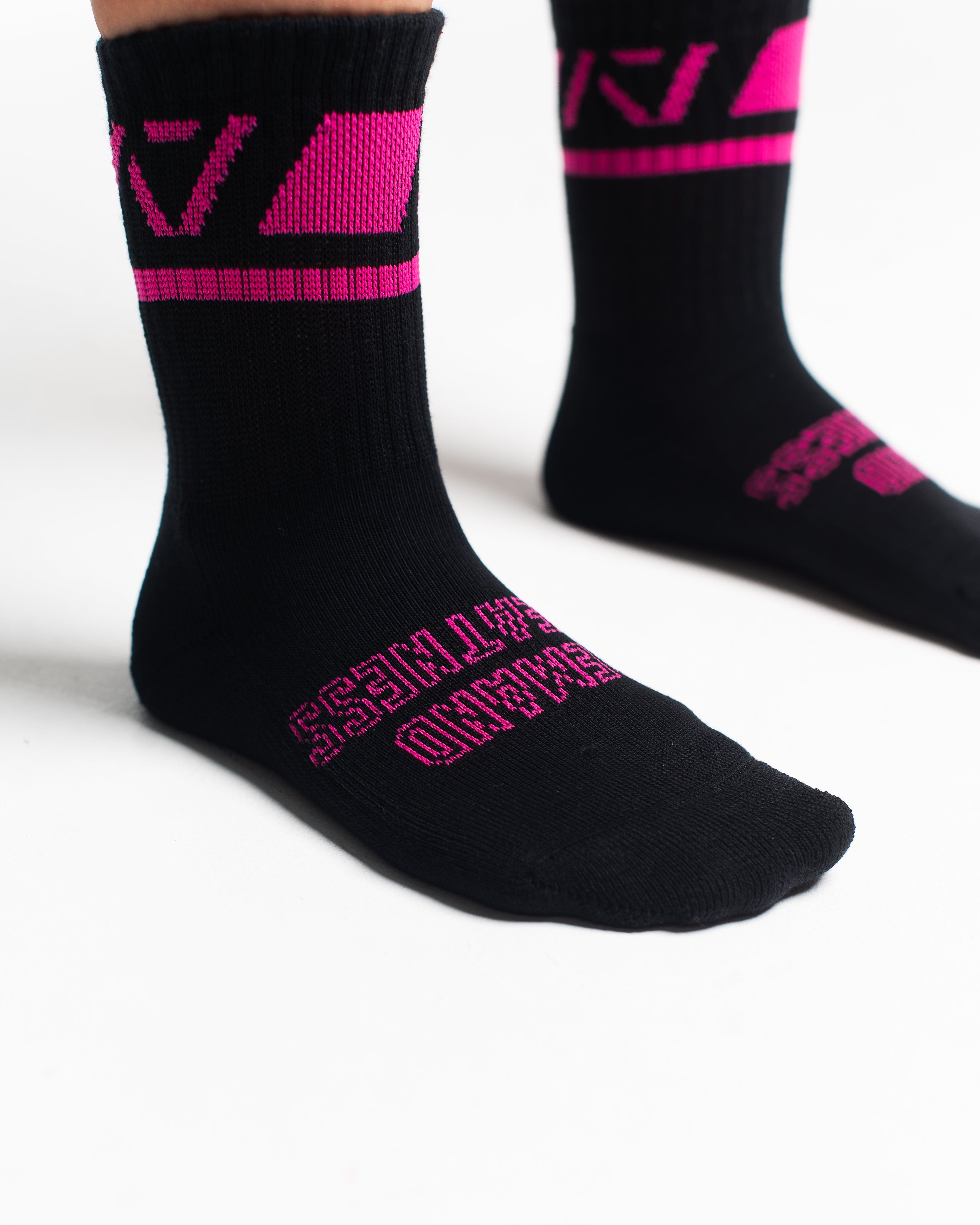 Close-up of the knit fabric on A7 Crew Socks in Flamingo, showing texture and stitching details.