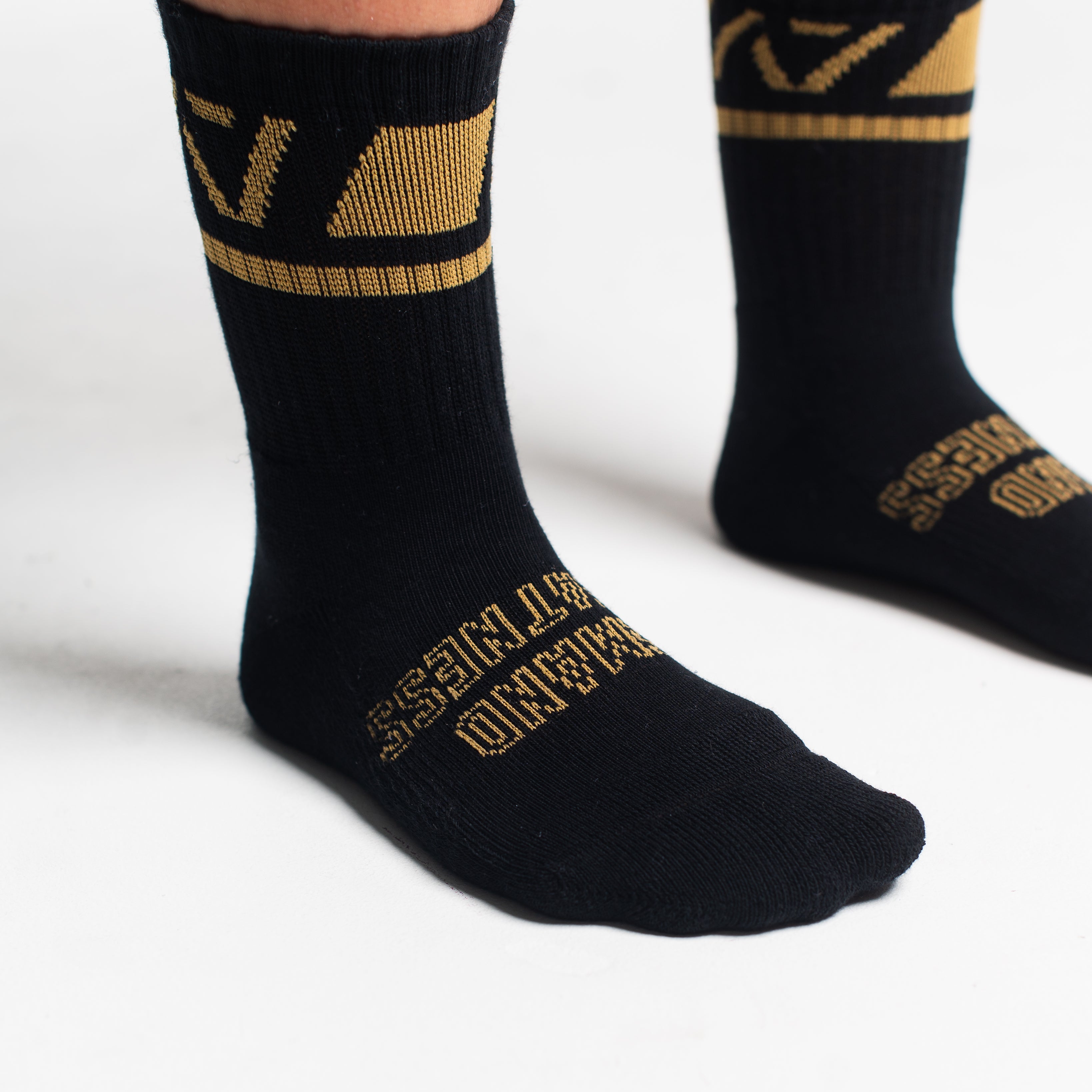 Close-up of the knit fabric on A7 Crew Socks in Gold Standard, showing texture and stitching details.