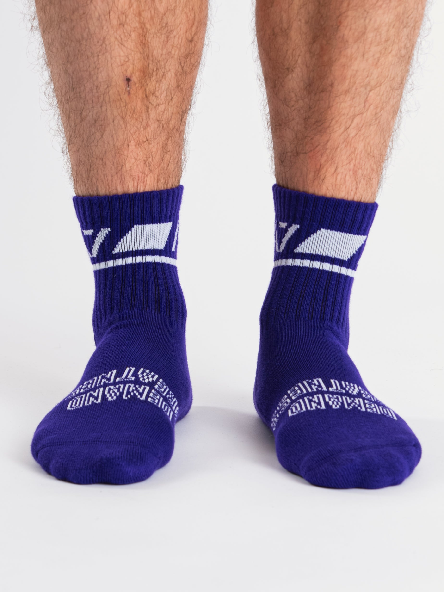 Front view of A7 Crew Socks in Purple, showcasing mid-shin length and ribbed cuff design.