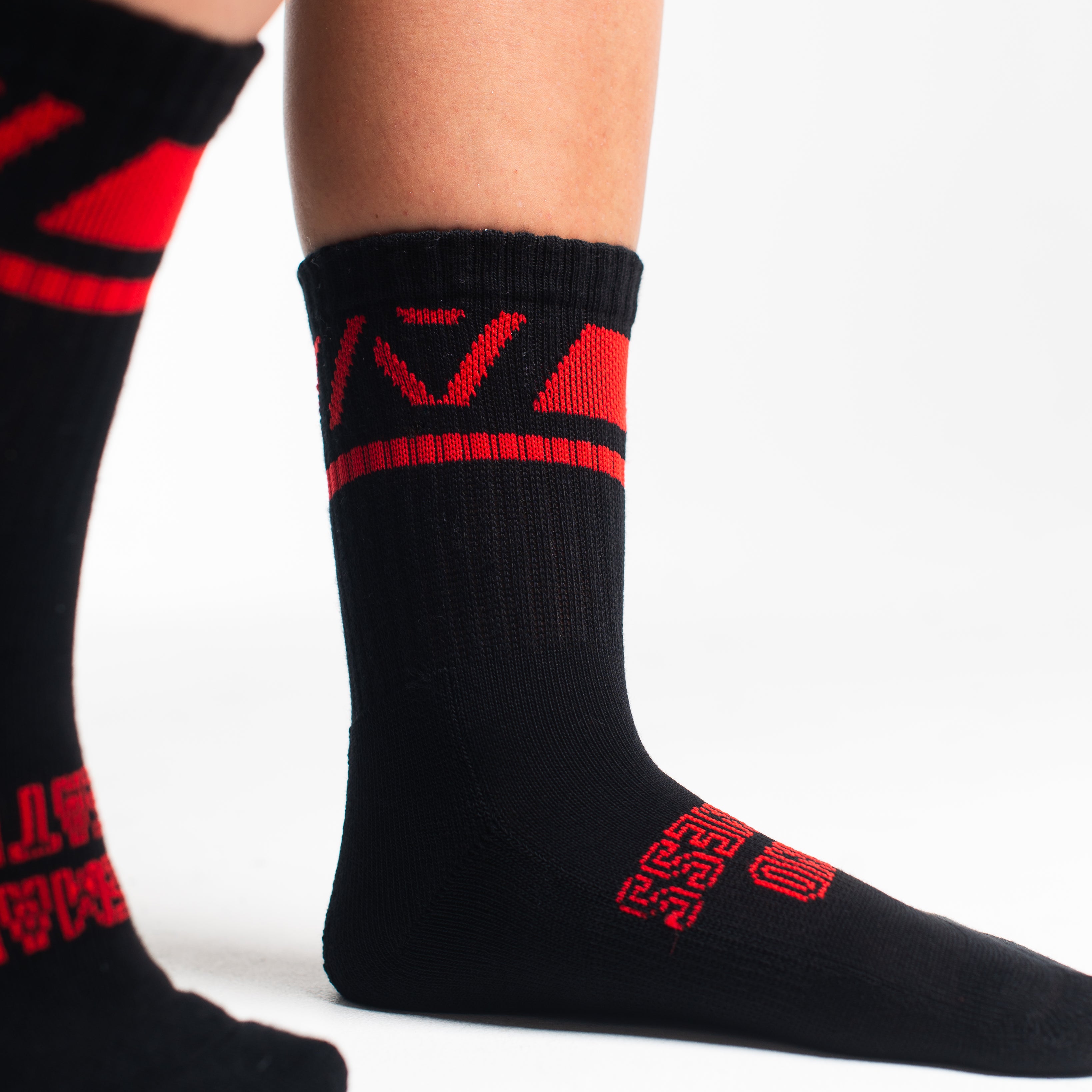 Close-up of the knit fabric on A7 Crew Socks in Red Dawn, showing texture and stitching details.