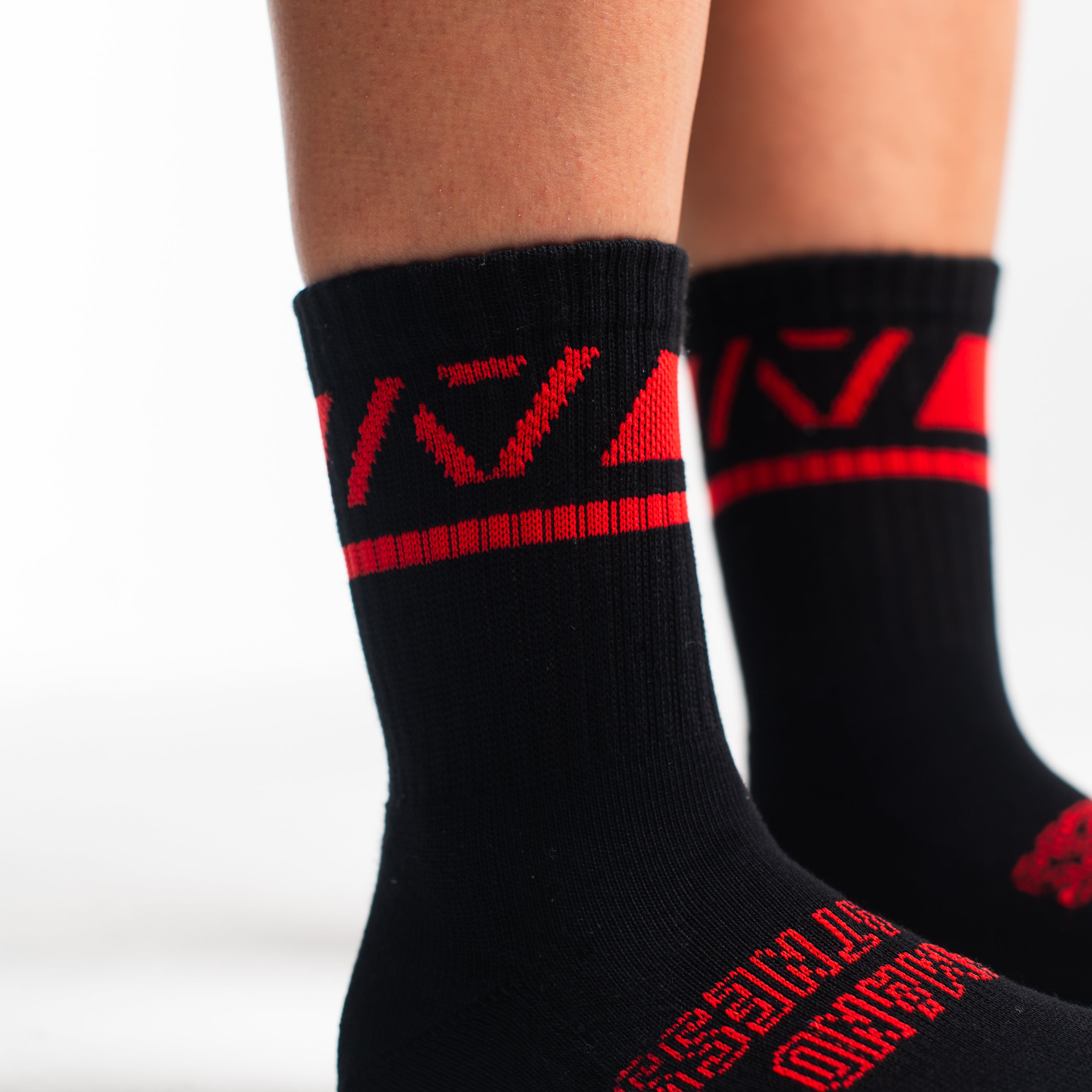 Close-up of the knit fabric on A7 Crew Socks in Red Dawn, showing texture and stitching details.