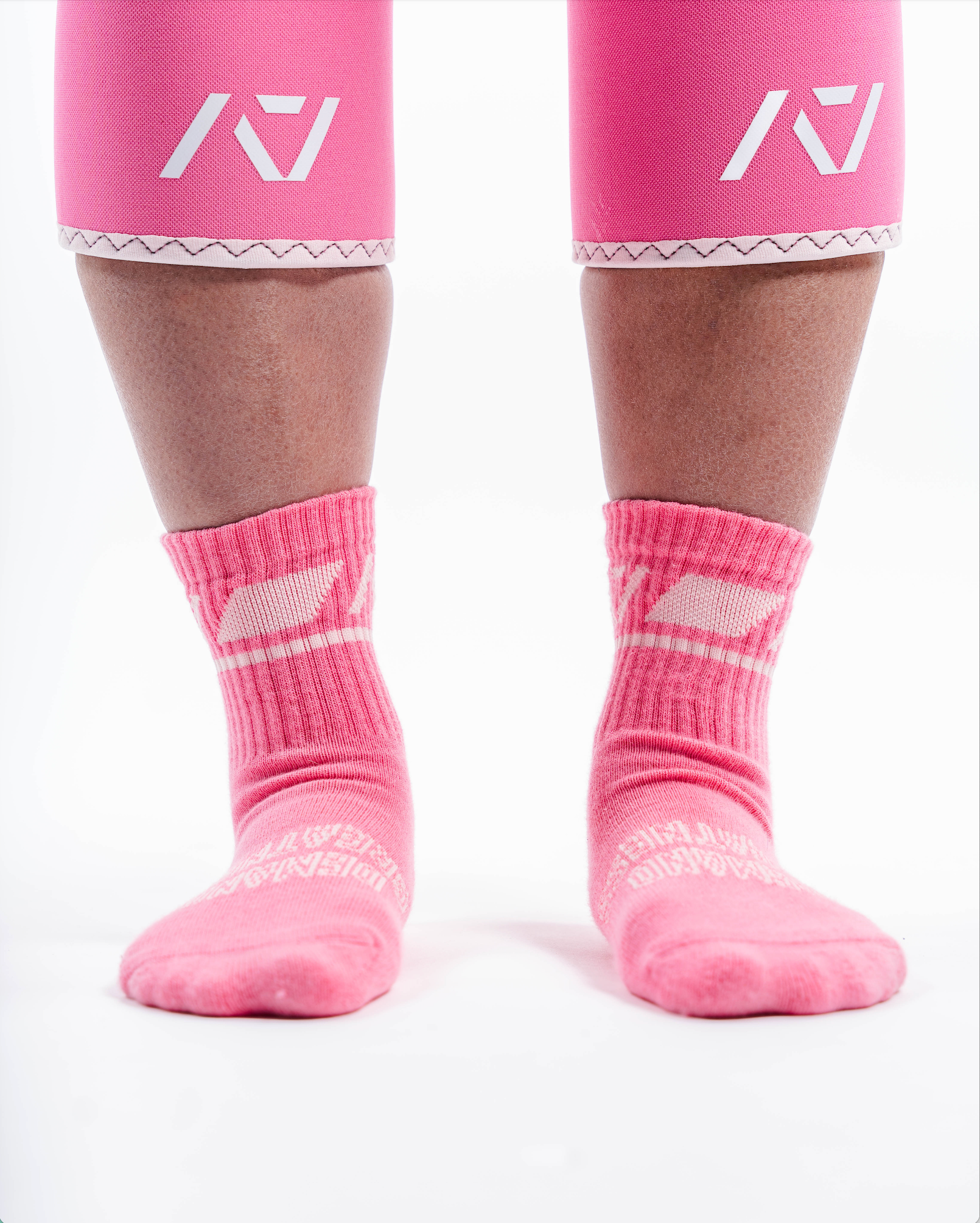 Front view of A7 Crew Socks in Roseite, showcasing mid-shin length and ribbed cuff design.