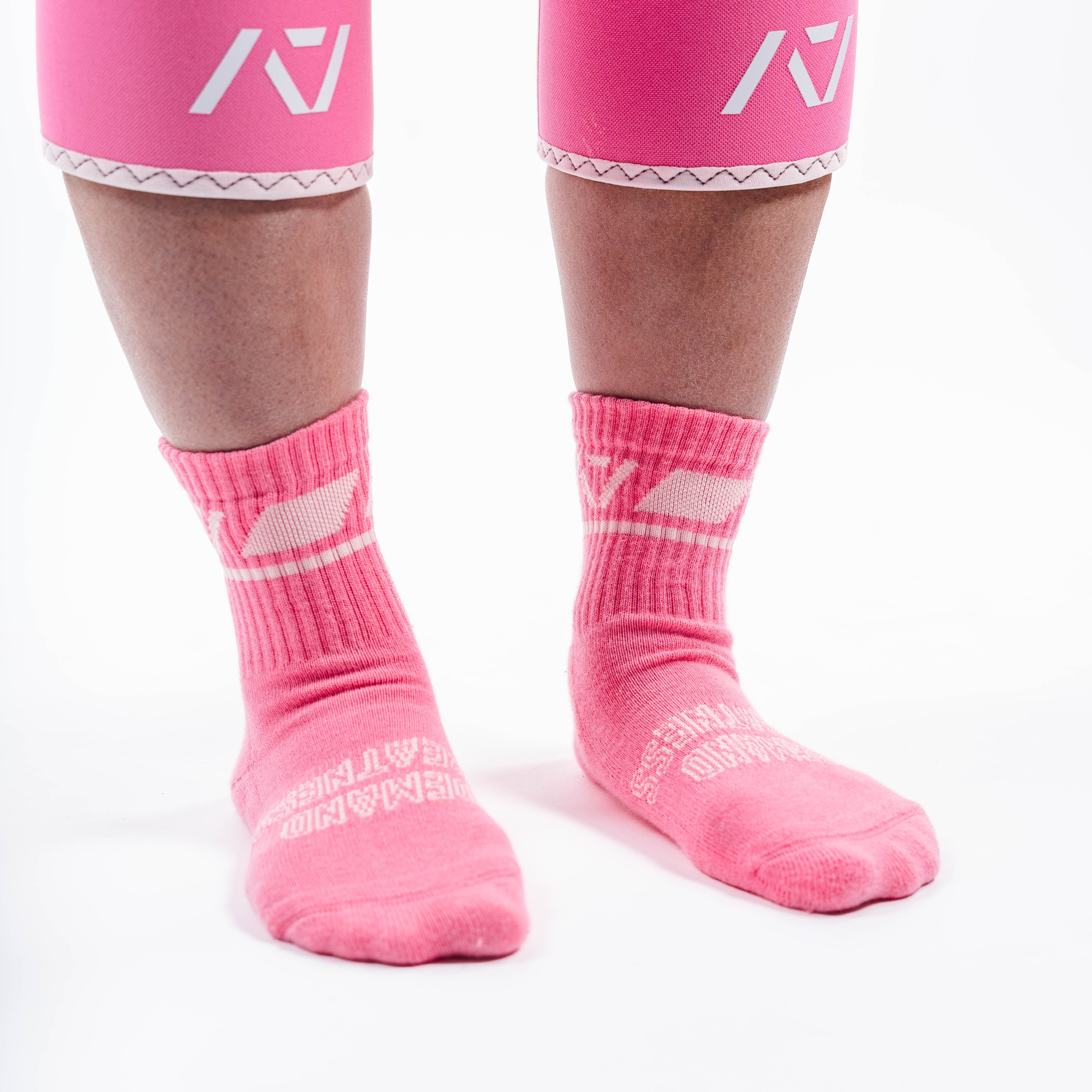 Side profile of A7 Crew Socks in Roseite, highlighting the A7 logo on the ankle and compression-style top.