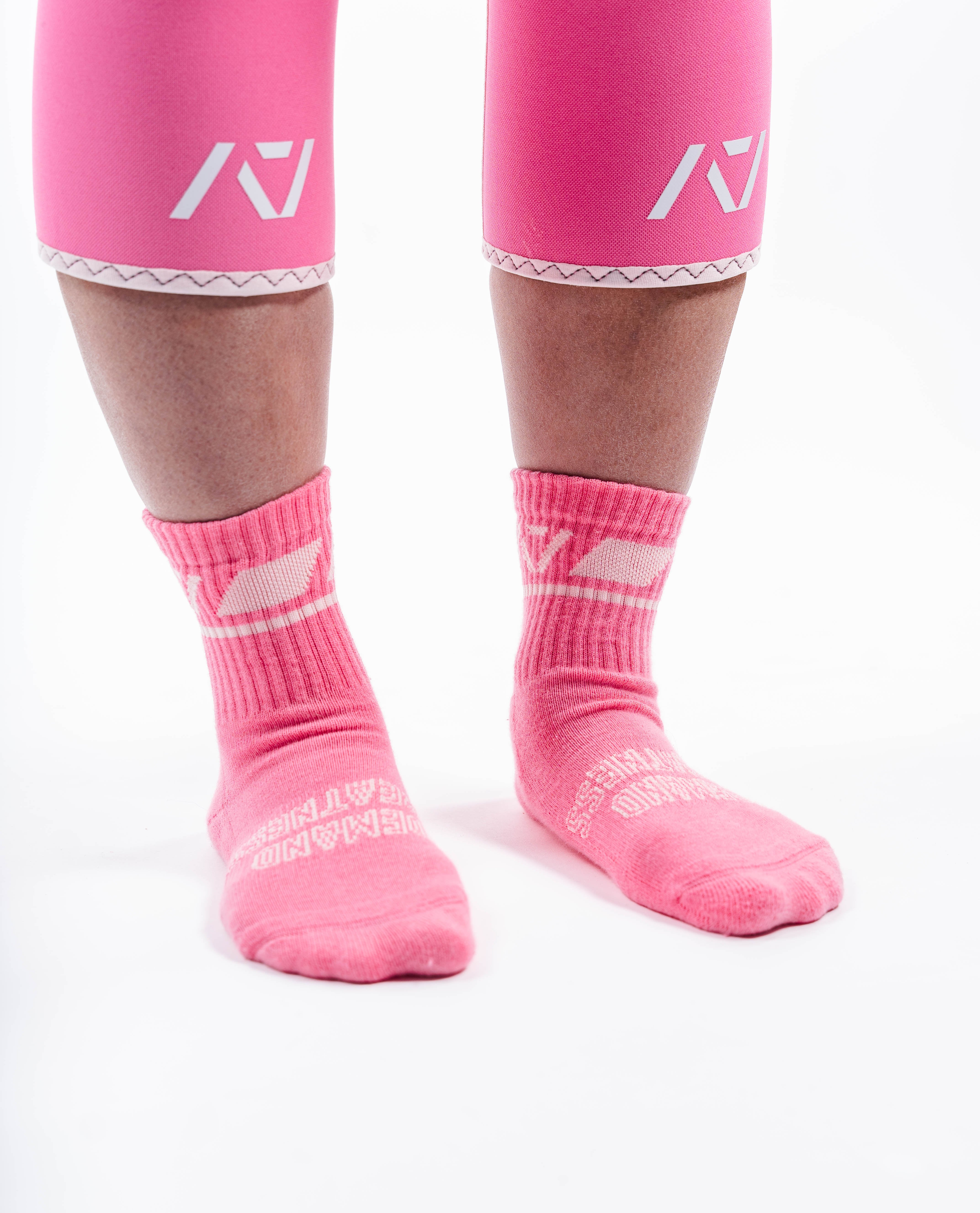 Side profile of A7 Crew Socks in Roseite, highlighting the A7 logo on the ankle and compression-style top.
