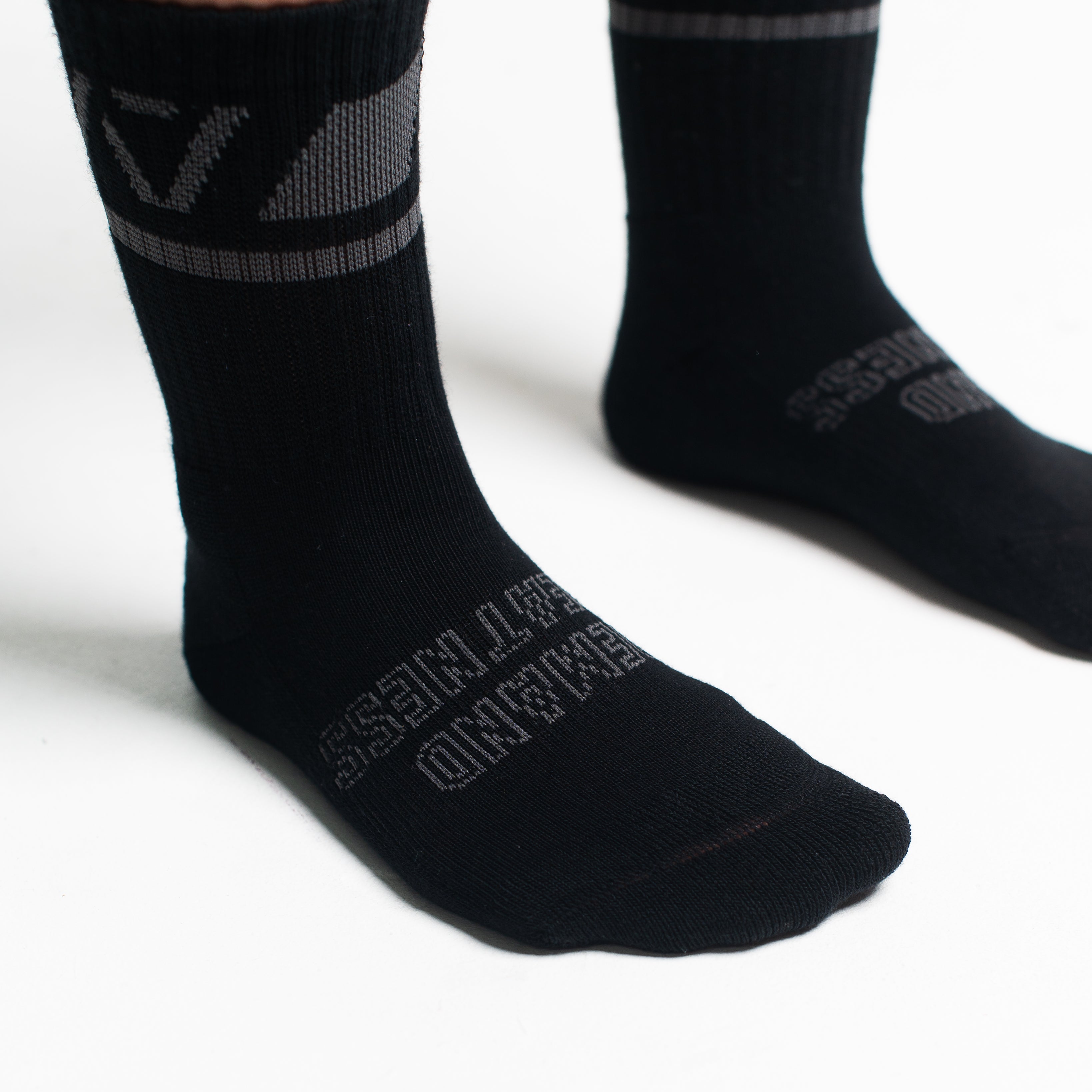 Close-up of the knit fabric on A7 Crew Socks in Shadow Stone, showing texture and stitching details.