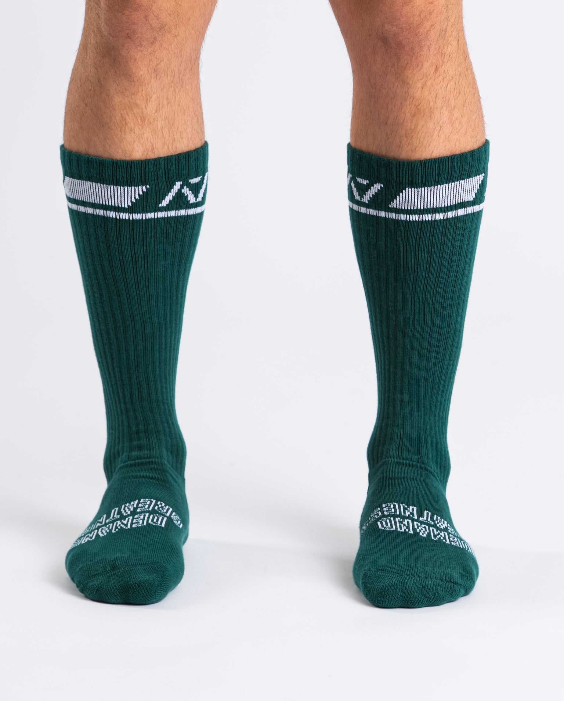 Front view of A7 Deadlift Socks in Emerald Forás, showcasing mid-shin length and ribbed cuff design.