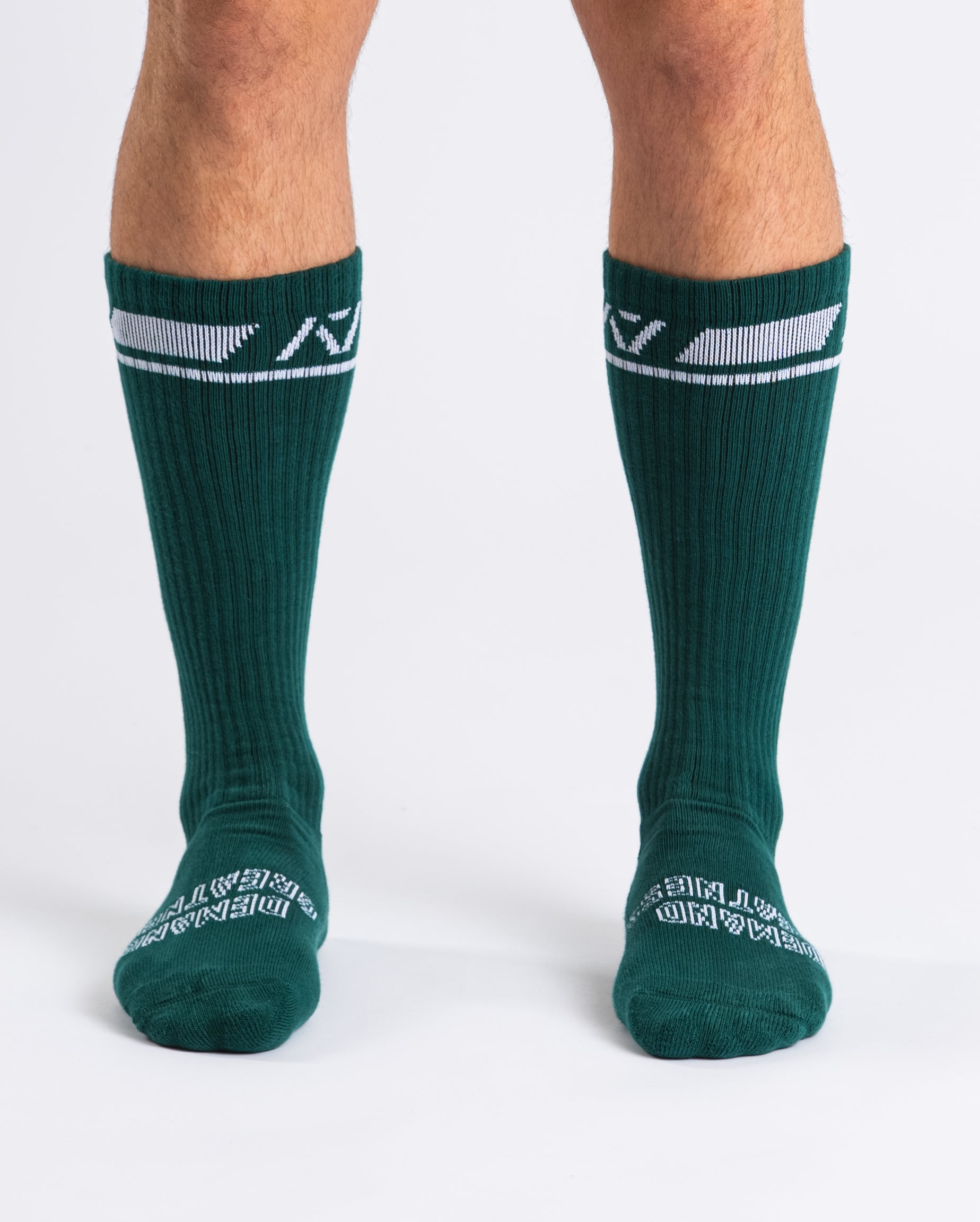 Front view of A7 Deadlift Socks in Emerald Forás, showcasing mid-shin length and ribbed cuff design.