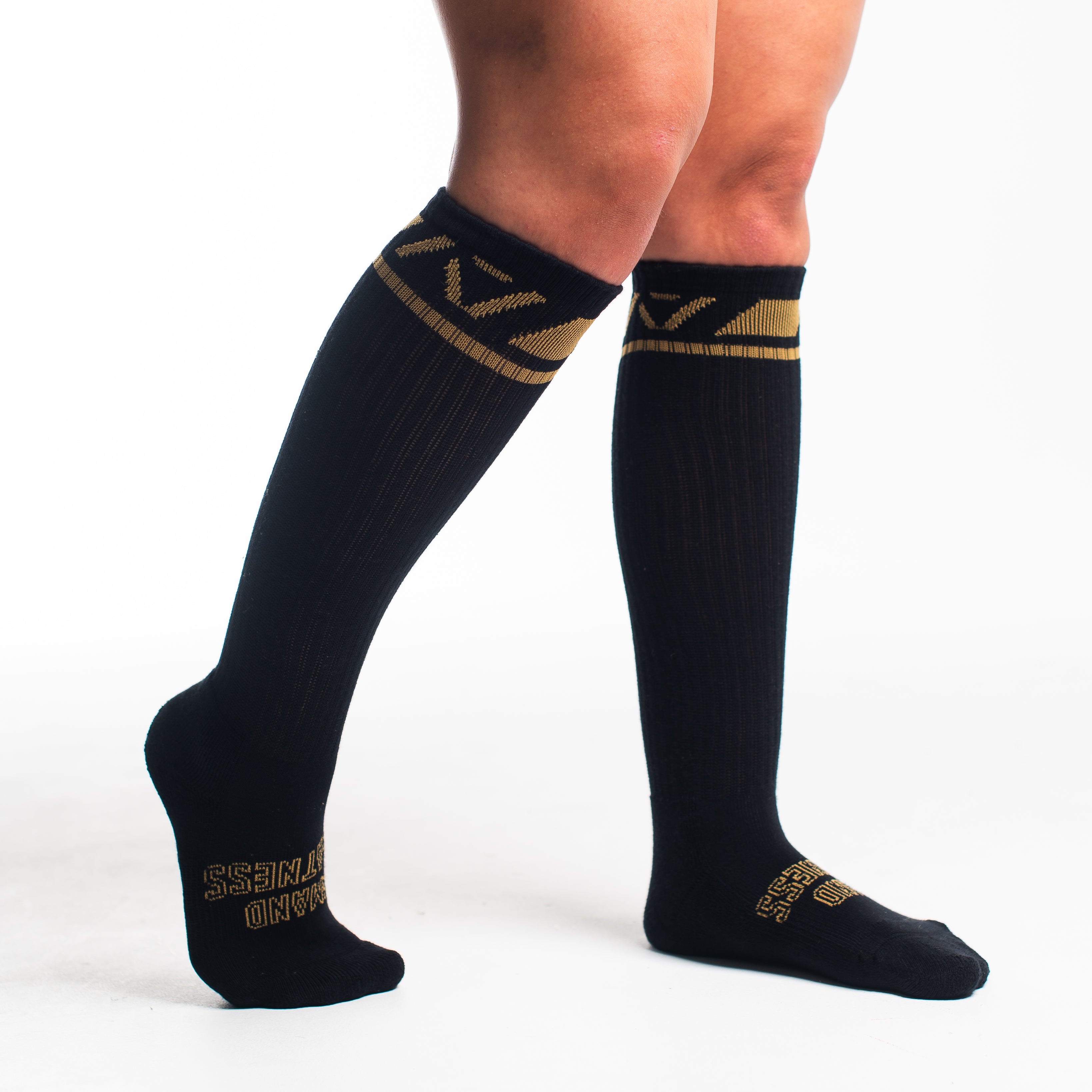 Side profile of A7 Deadlift Socks in Gold Standard, highlighting the A7 logo on the ankle and compression-style top.