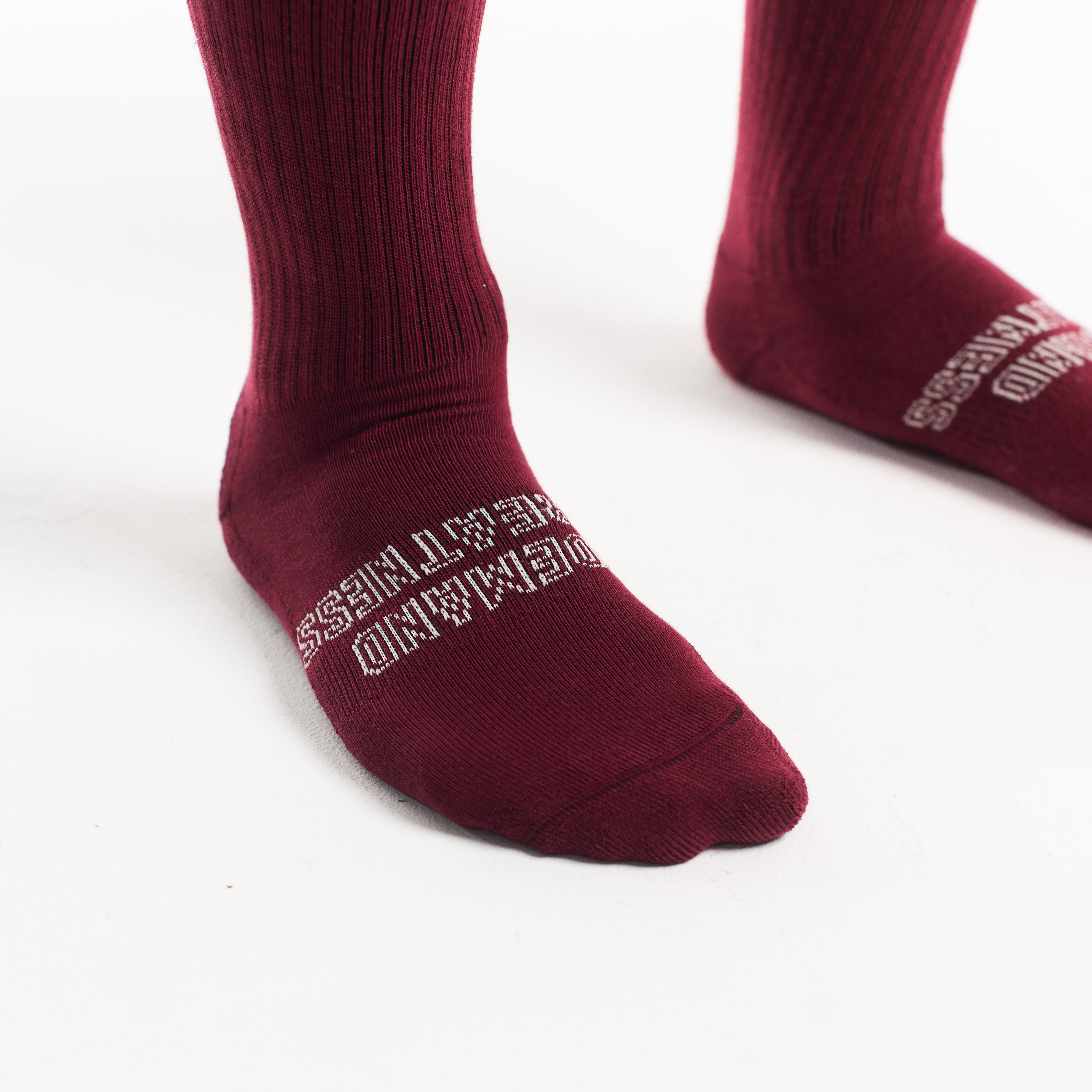 Close-up of the knit fabric on A7 Deadlift Socks in Ivory Rose, showing texture and stitching details.