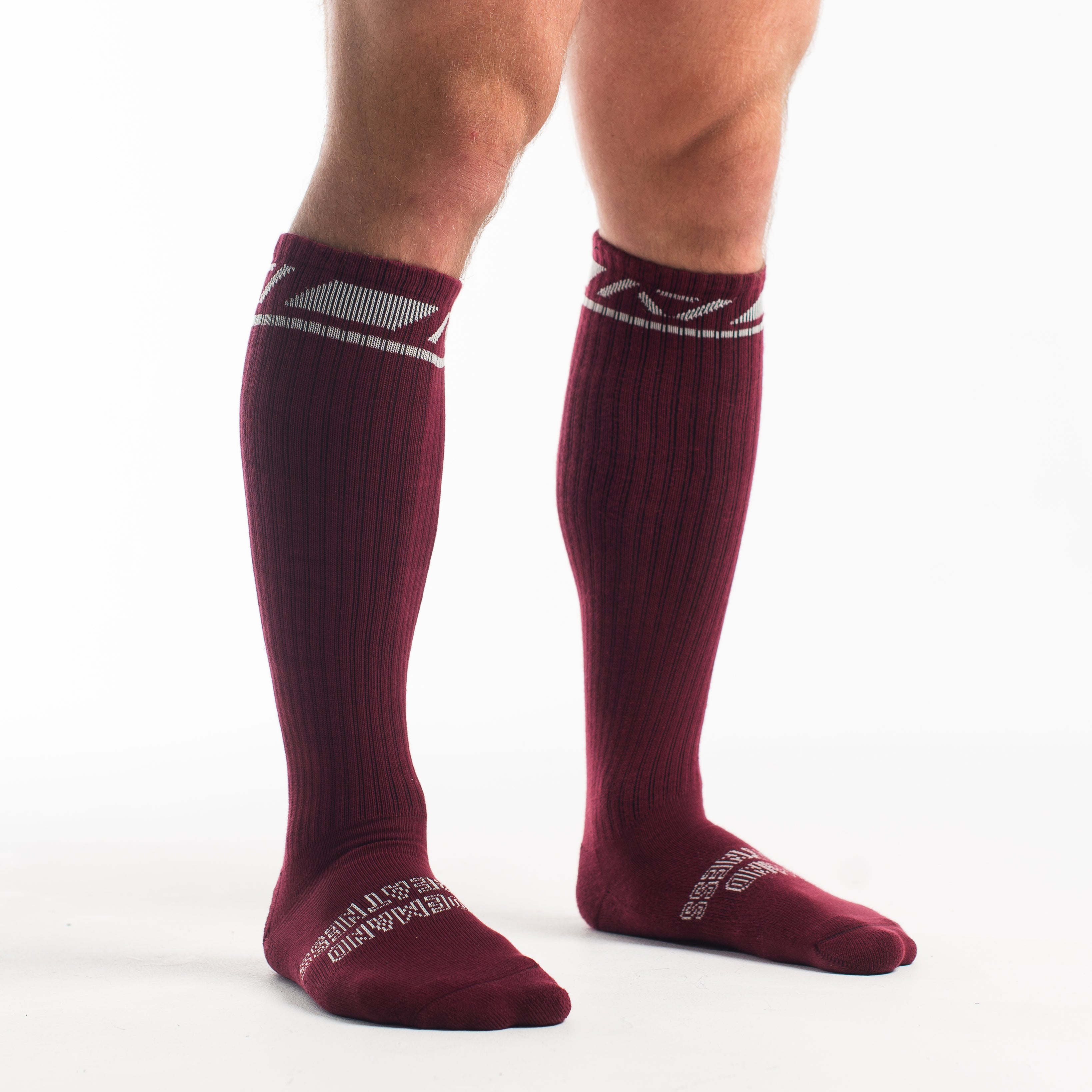 Side profile of A7 Deadlift Socks in Ivory Rose, highlighting the A7 logo on the ankle and compression-style top.