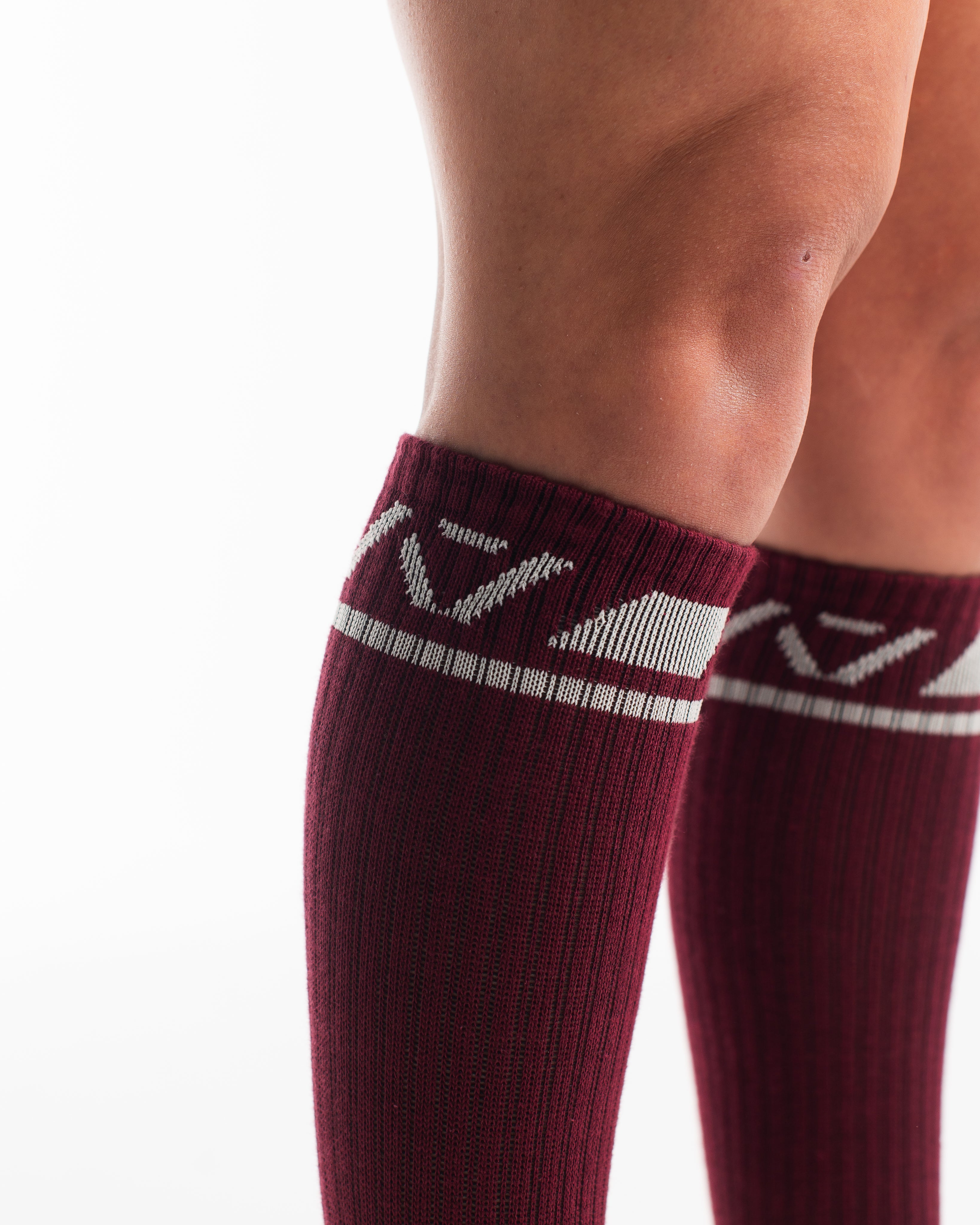 Side profile of A7 Deadlift Socks in Ivory Rose, highlighting the A7 logo on the ankle and compression-style top.