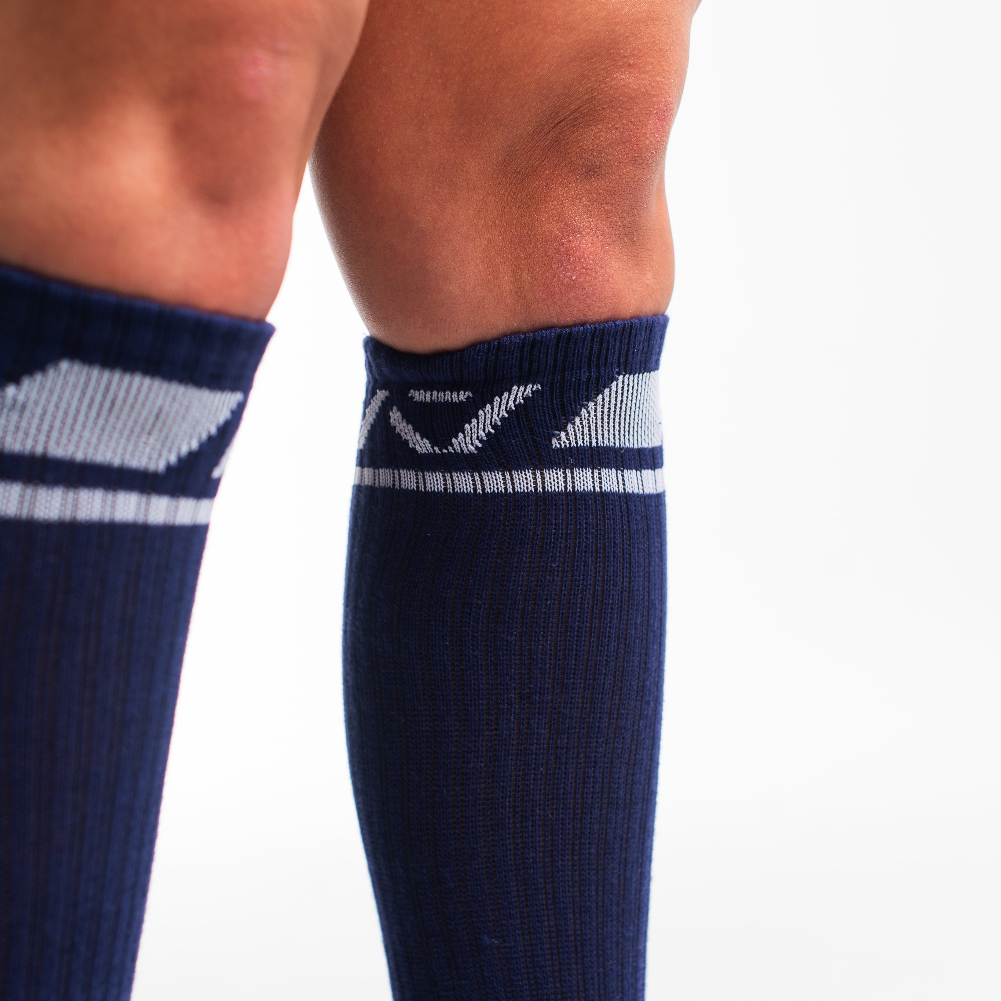 Close-up of the knit fabric on A7 Deadlift Socks in Night Light, showing texture and stitching details.