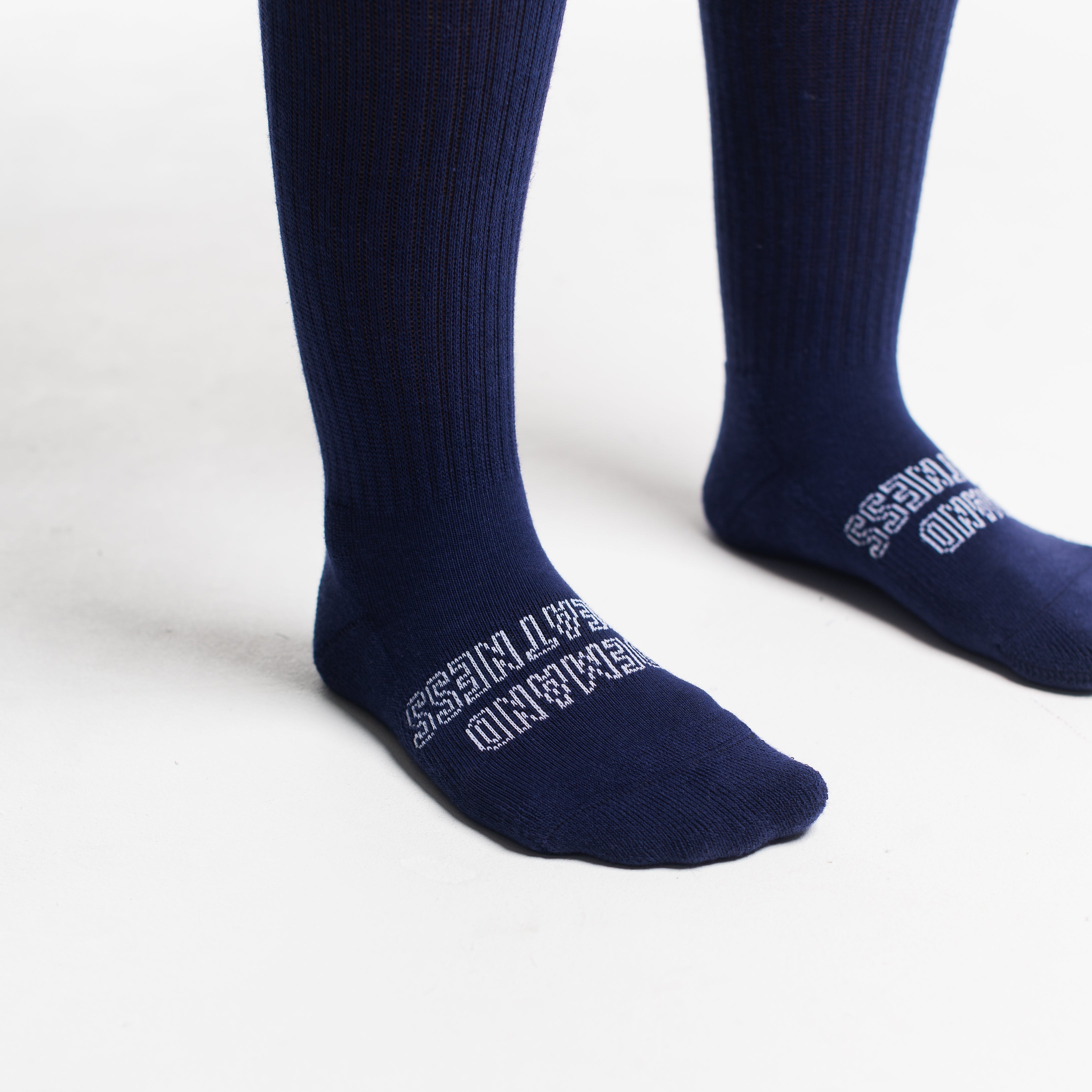 Close-up of the knit fabric on A7 Deadlift Socks in Night Light, showing texture and stitching details.